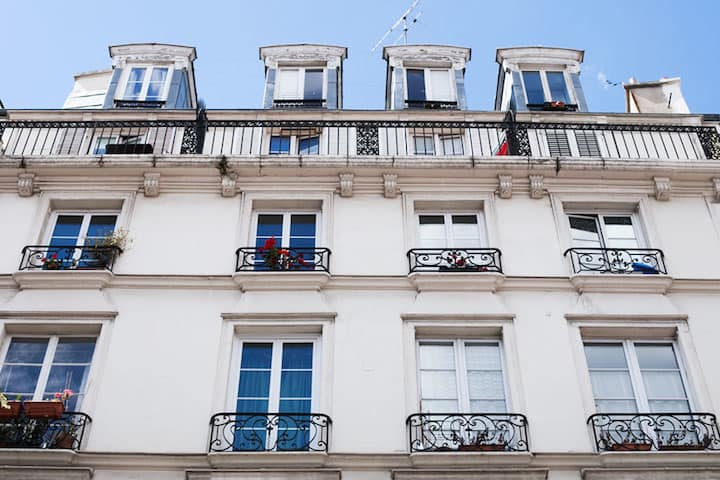 A Paris apartment building with balconies near Le Bon Marché department store.
