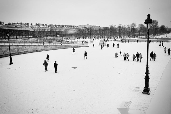 A Romantic Winter in Paris: Sip a mug of hot chocolate, enjoy ice skating on the Eiffel Tower, visit Le Carnavalet, and snuggle with your lover at Paris' fireplace bars