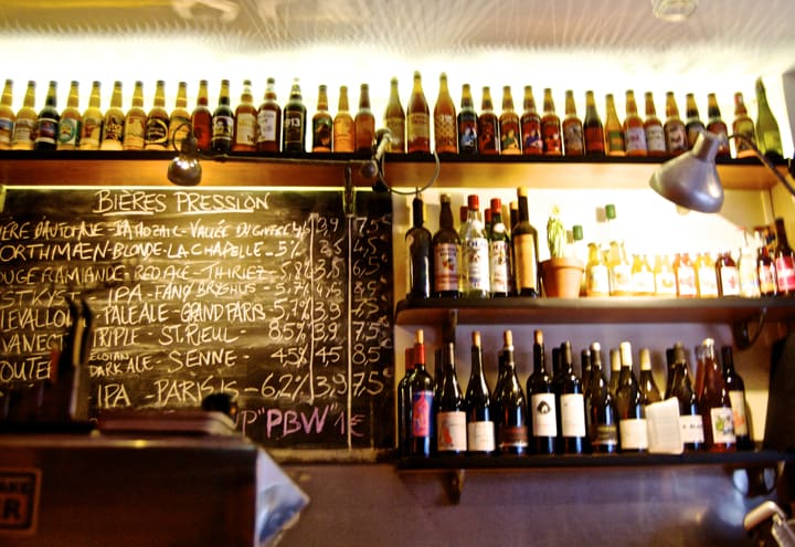Paris 20th Arrondissement: Best bars, restaurants, and cafés around Belleville and Menilmontant like les Trois 8, which has tons of wine and beer to taste, as you can see from the selection on the blackboard behind the bar