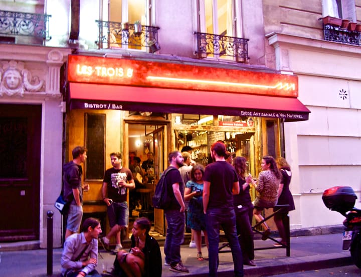 Paris 20th Arrondissement: Best bars, restaurants, and cafés around Belleville and Menilmontant like les Trois 8, with its neon sign and punters who stand outside sipping on a beer in summer.