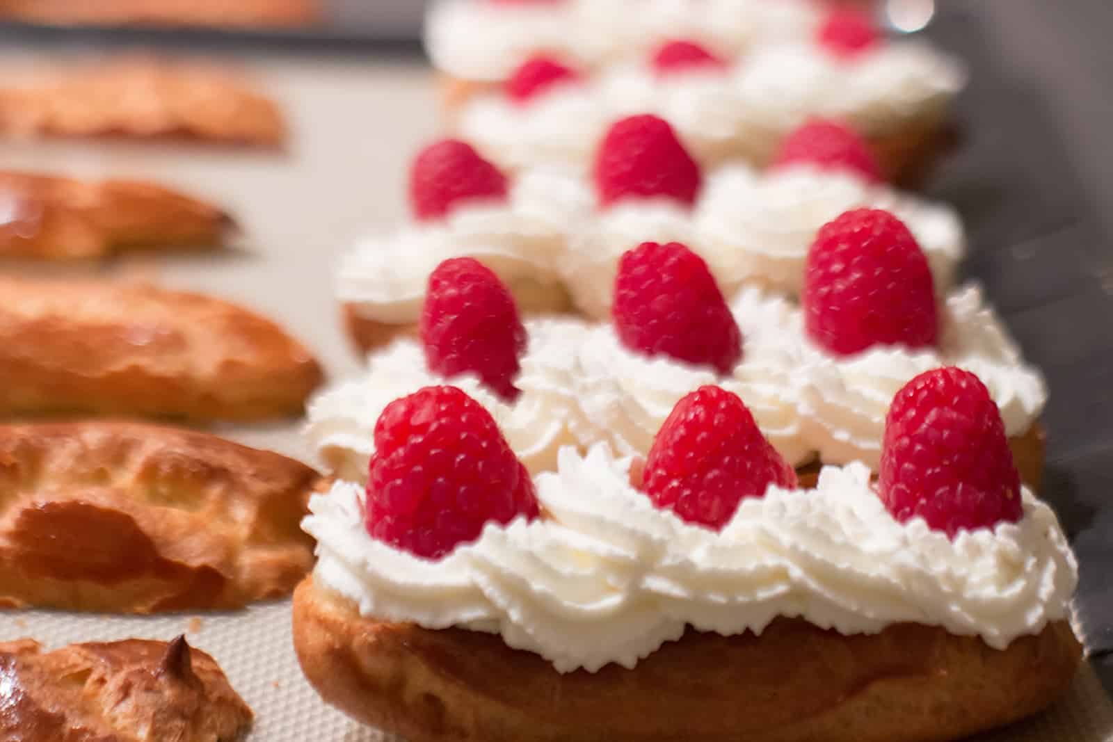 The Five Best Apps for Food-Lovers in Paris will help you find great local places to eat, drink and take baking classes like at La Cuisine, where you'll learn how to make these creamy desserts with raspberries on top.