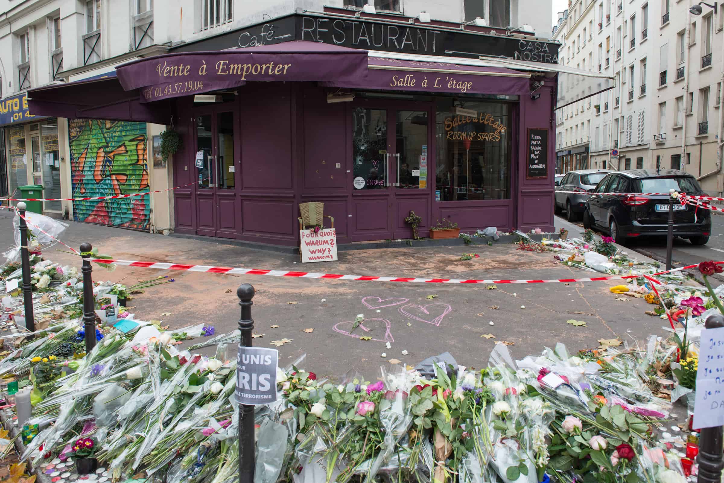 Je suis Paris. Images of peace and hope. Despite the barrier, people have drawn chalk hearts to accompany the flowers in front of Le Petit Cambodge. Palmyre Roigt for the HiP Paris Blog