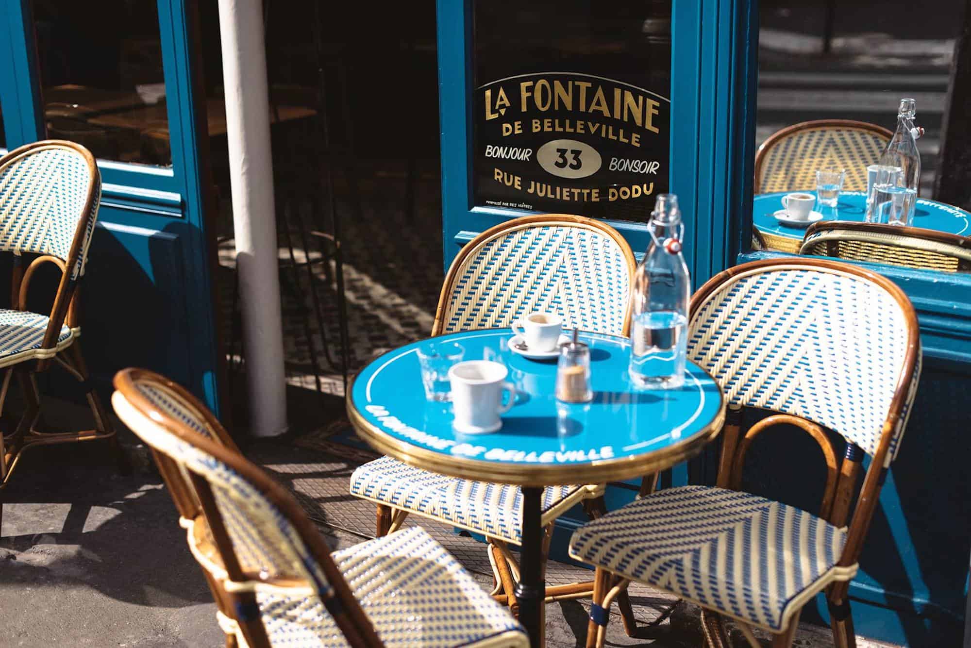 HiP Paris Blog rounds up the top brunch spots in Paris like the Fontaine de Belleville cafe and its blue exterior and outdoor seating area.