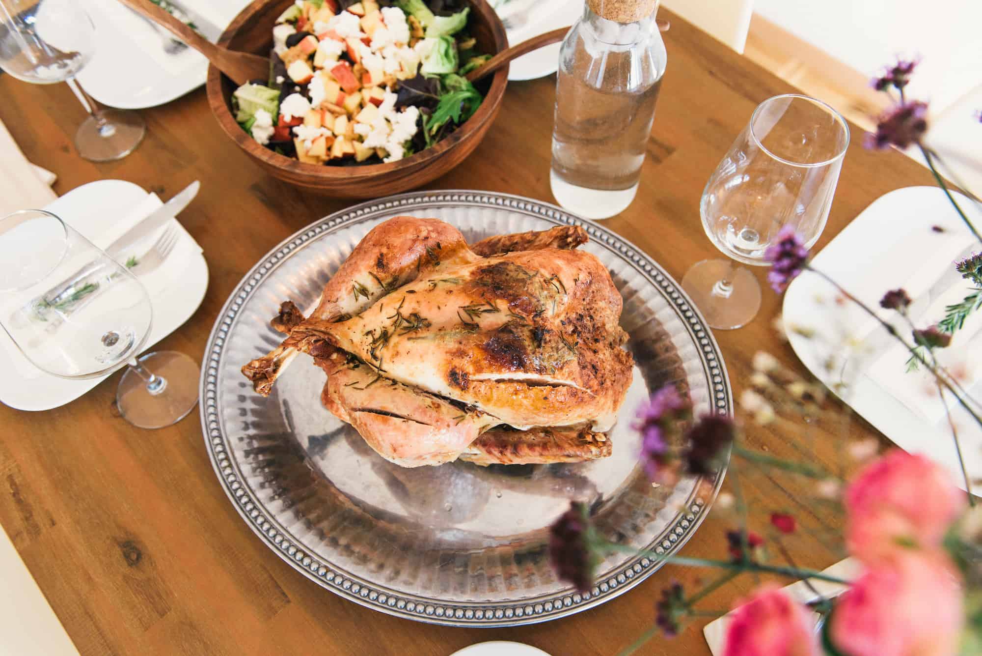 A Thankgiving roasted turkey served in a silver platter.