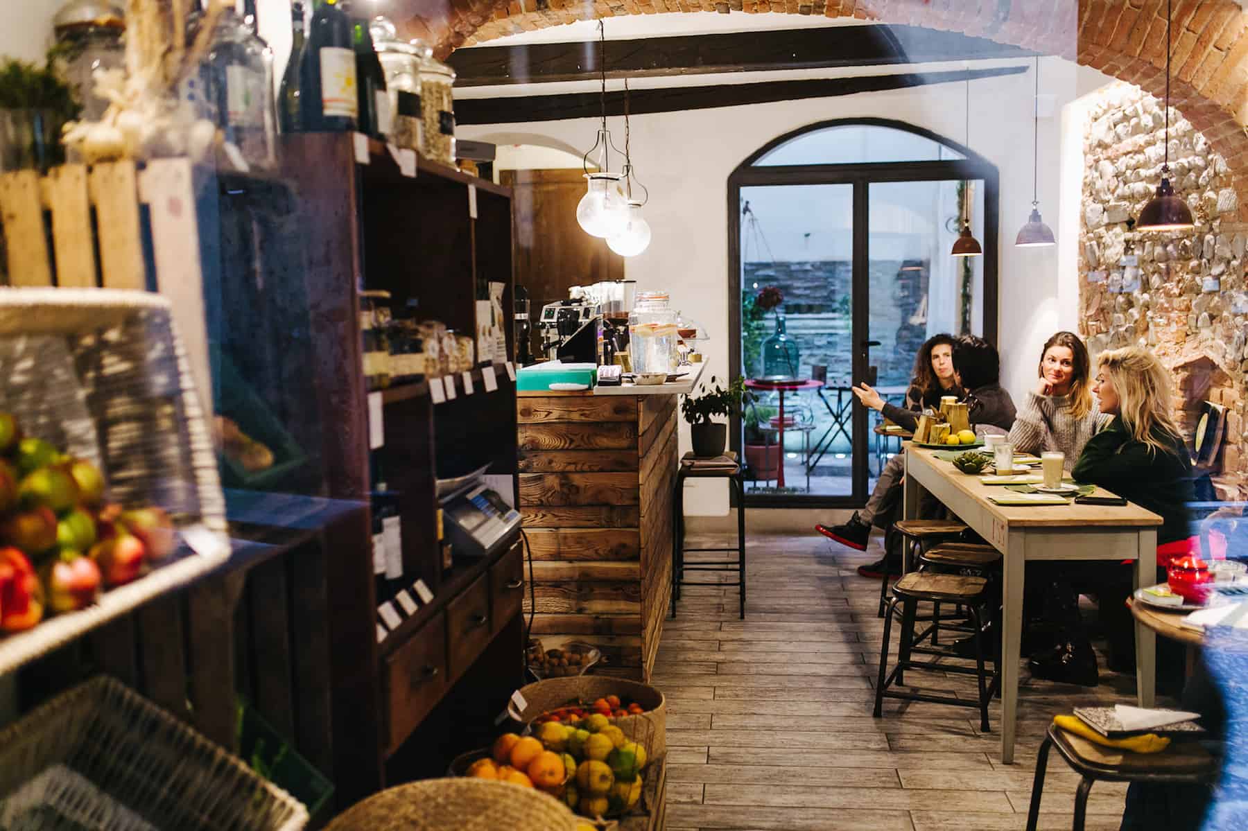 Inside Carduccio organic restaurant in Florence, with its rustic stone interiors.