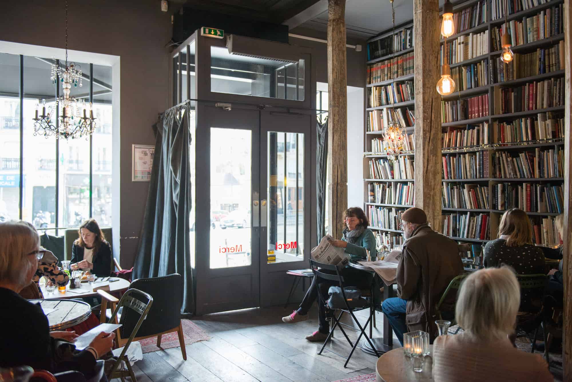 HiP Paris Blog rounds up Paris' best concept store cafes like at Merci, where the walls are lined with second-hand books.