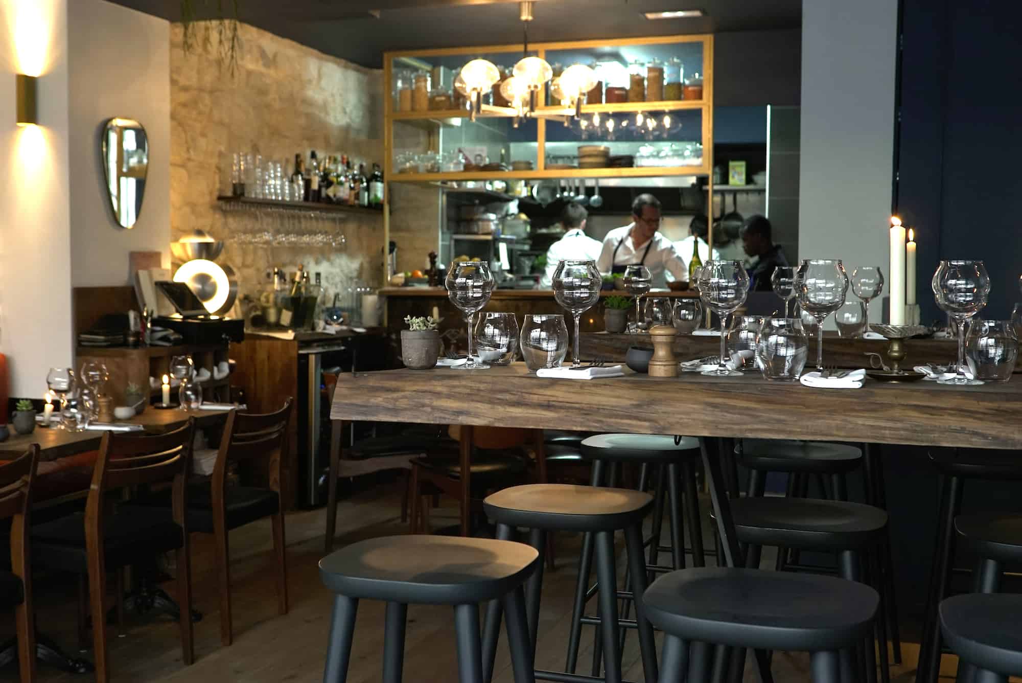 Inside new Montmartre restaurant VAVA, with its exposed stone walls and timber tables. 