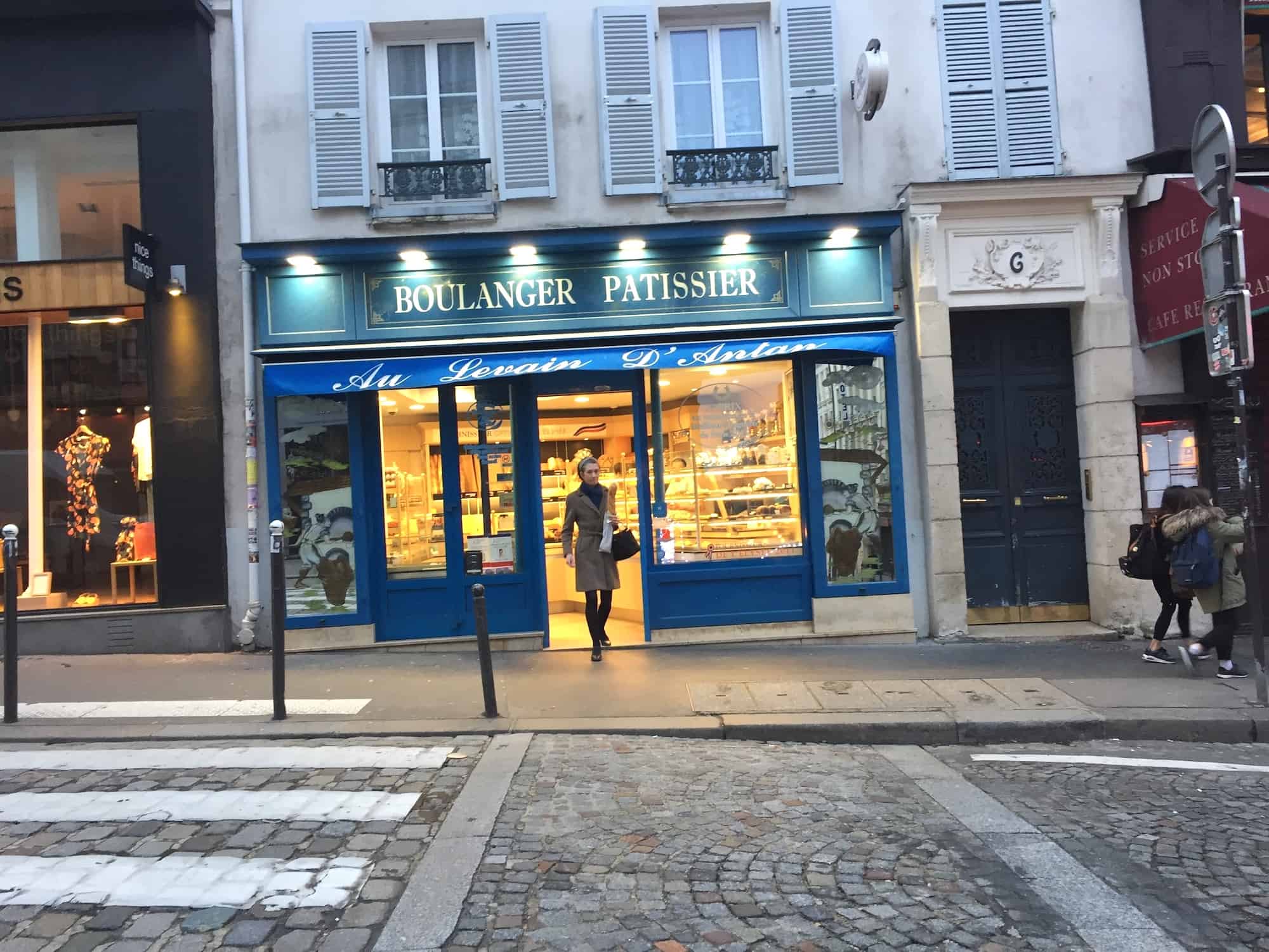 The best four bakeries in Paris' Abbesses area, including Au Levin D'Antan boulangerie with its blue exterior.