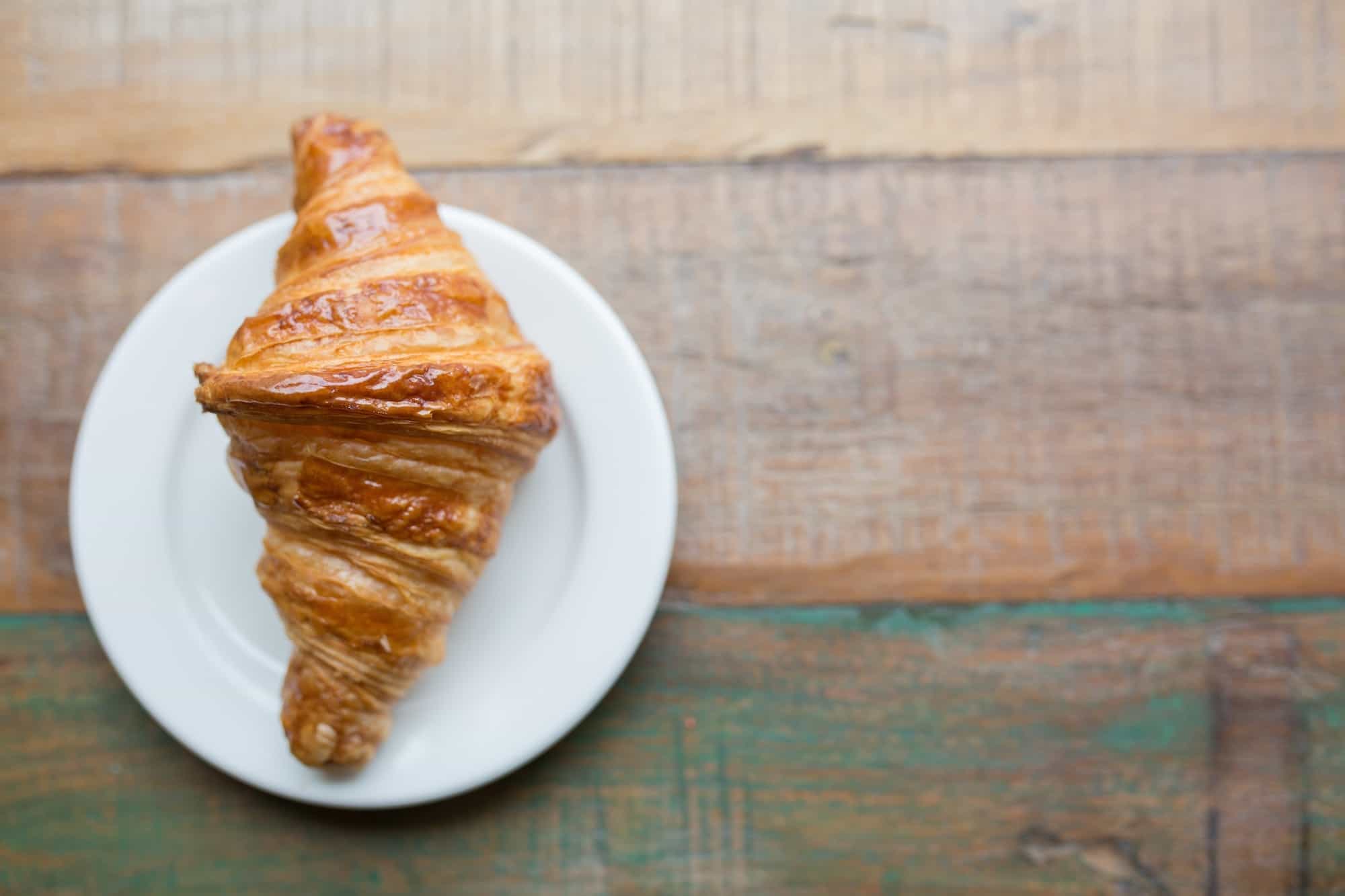 Where to buy the best croissants in Paris' Montmartre, like this fluffy, buttery croissant.