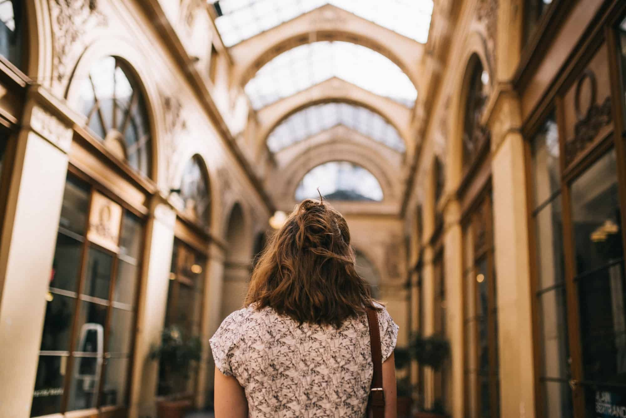 We want to know what your favorite places to explore in Paris are, like this girl, who loves to visit Paris' covered passageways.