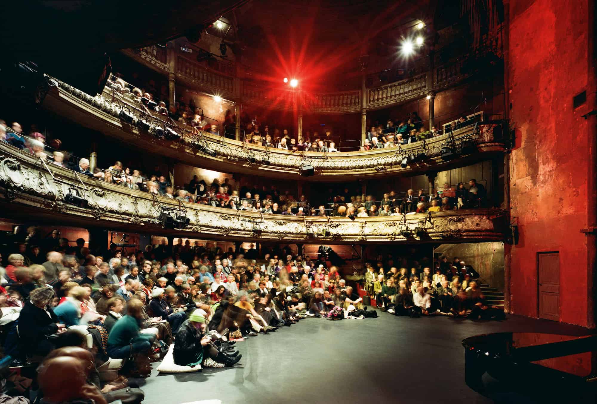 Inside one of the best theatres in Paris, the Bouffes de Nord, with its wooden seating area, which located close to La Chapelle neighborhood.