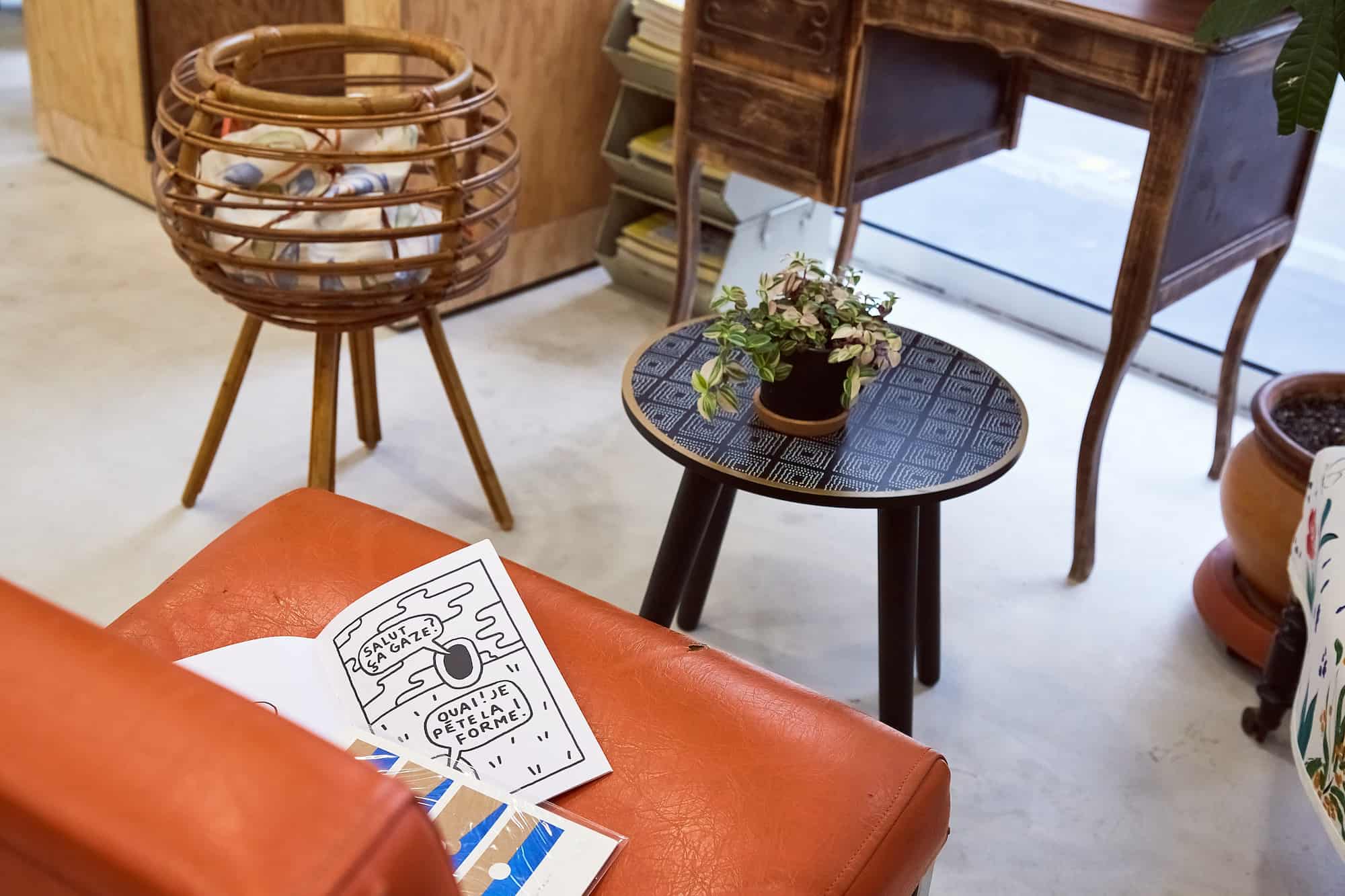 Inisde Paris' vegan concept store Aujourd'hui Demain, you'll find handcrafted furniture like this orange faux-leather armchair and coffee table.