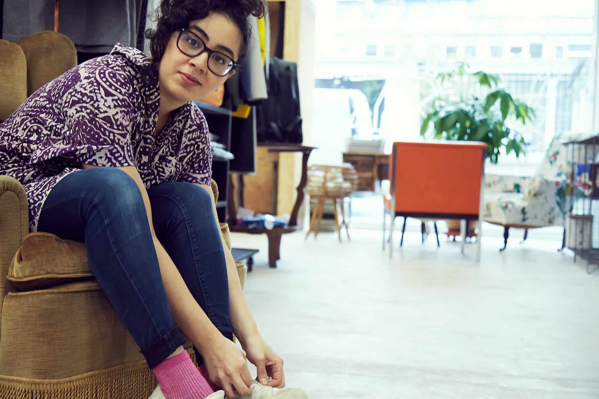 At Paris' green concept store Aujourd'hui Demain, you'll find vintage furniture and some great fashion apparel too like shoes being tried on by this girl sitting in a velvet armchair.