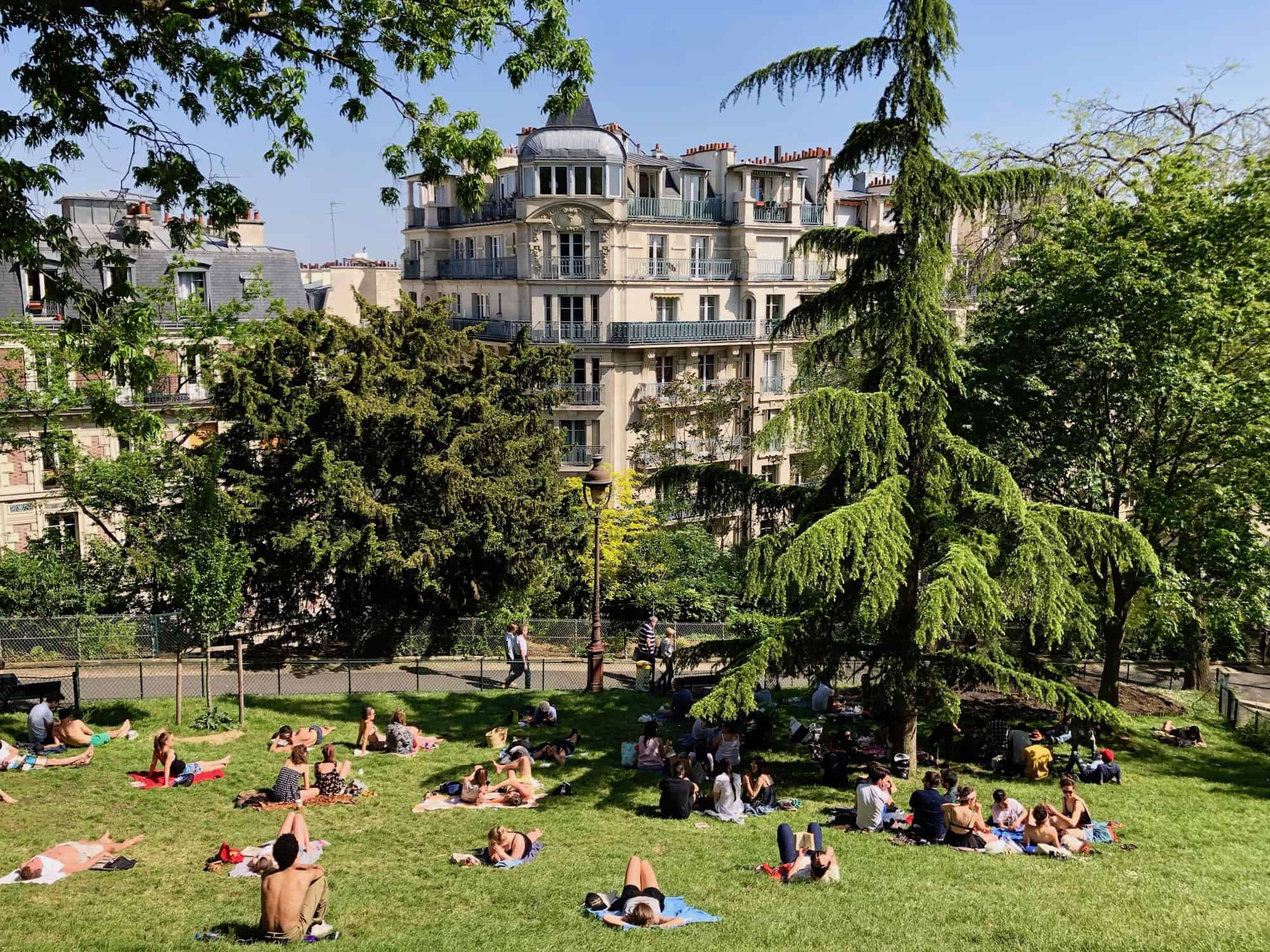HiP Paris Blog tells you about one writer's experience learning French in Paris and how they explored the city's hidden parks like this spot behind the Sacré Coeur where locals like to tan in summer.