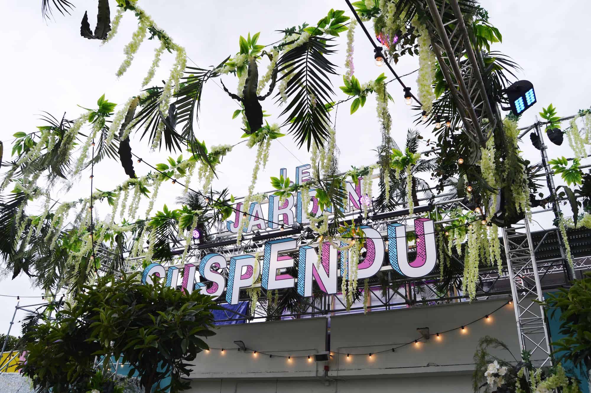 Paris rooftop bar Le Jardin Suspendu (the hanging garden) name adorned with leafy decor.