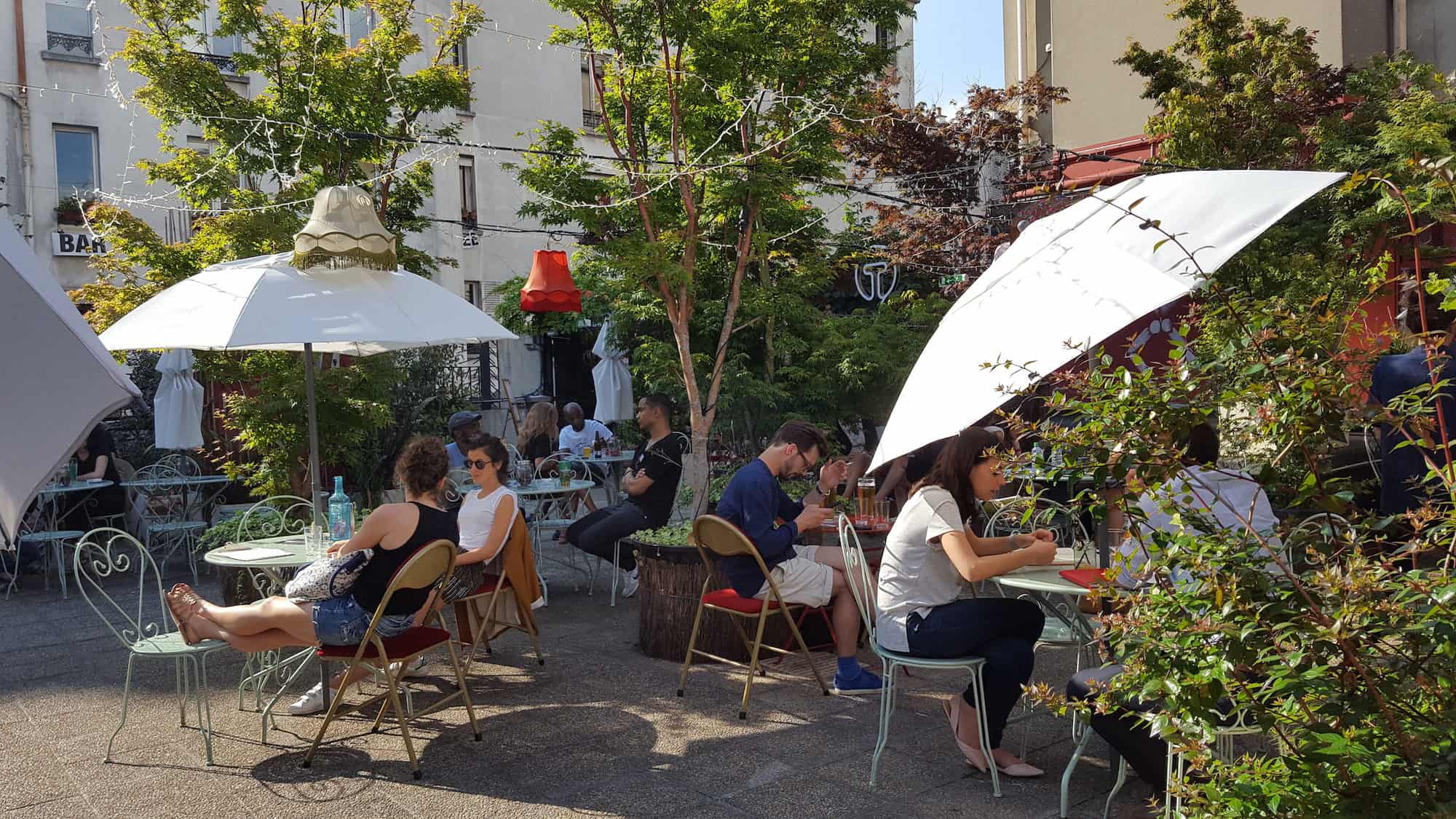 Best rooftop bar in Paris' Pigalle neighborhood is Le Bar à Bulles with its leafy terrace and fairylights.