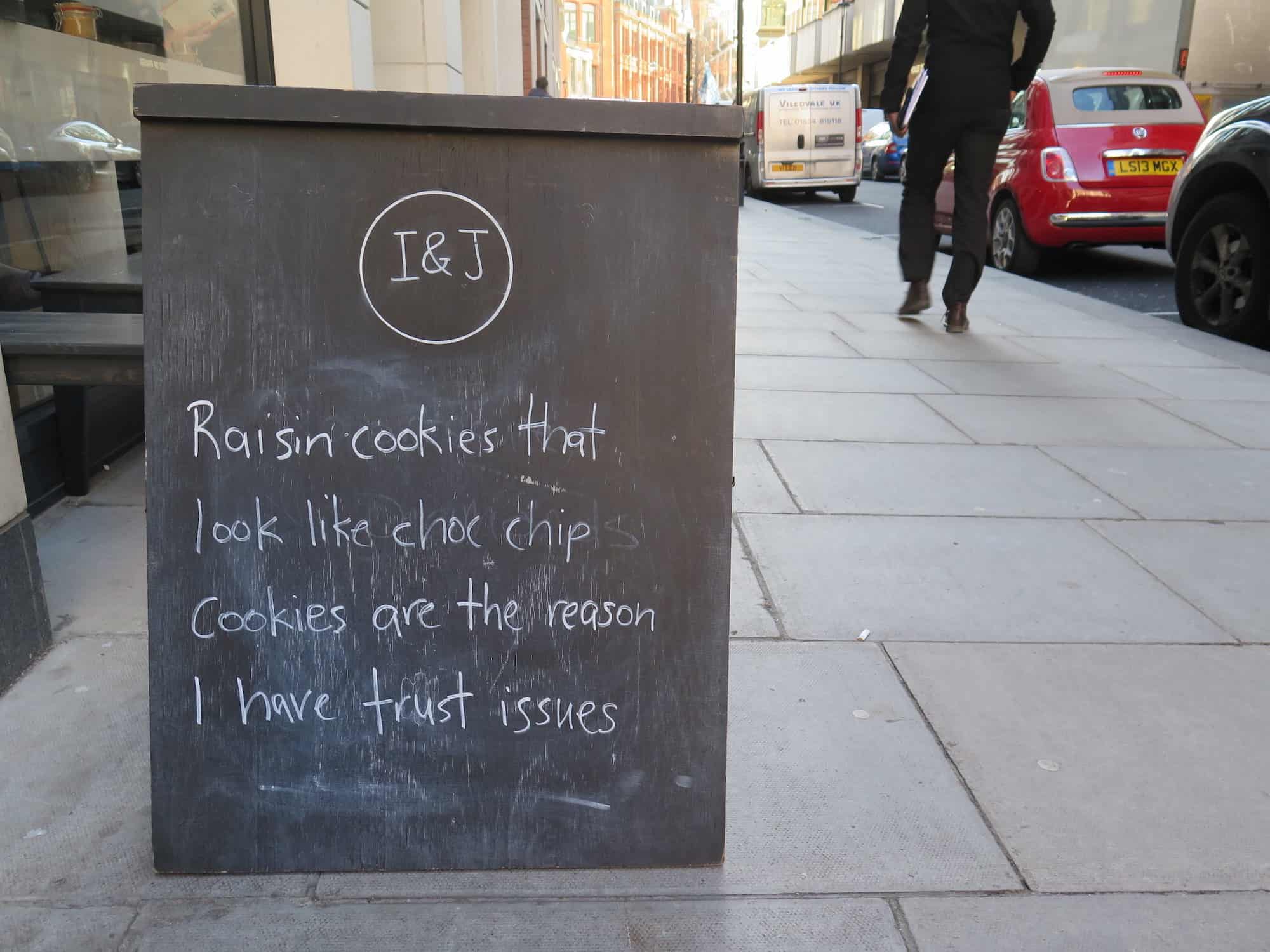 Paris or London for humor? We'd say London for its funny coffee shop street signs.