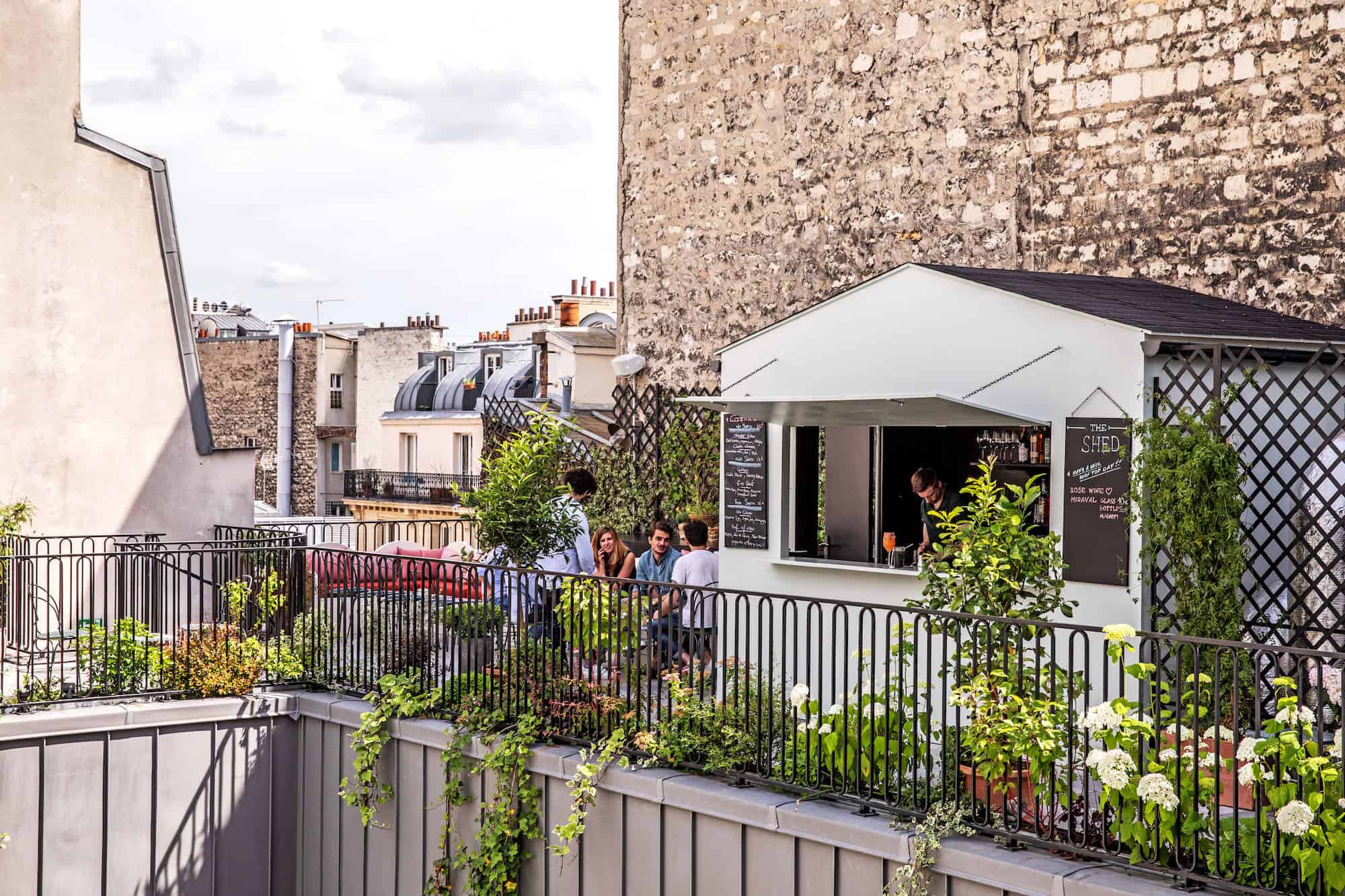 The Shed is one of the best Paris rooftop bars for summer cocktails with views of the surrounding Parisian chimney tops.