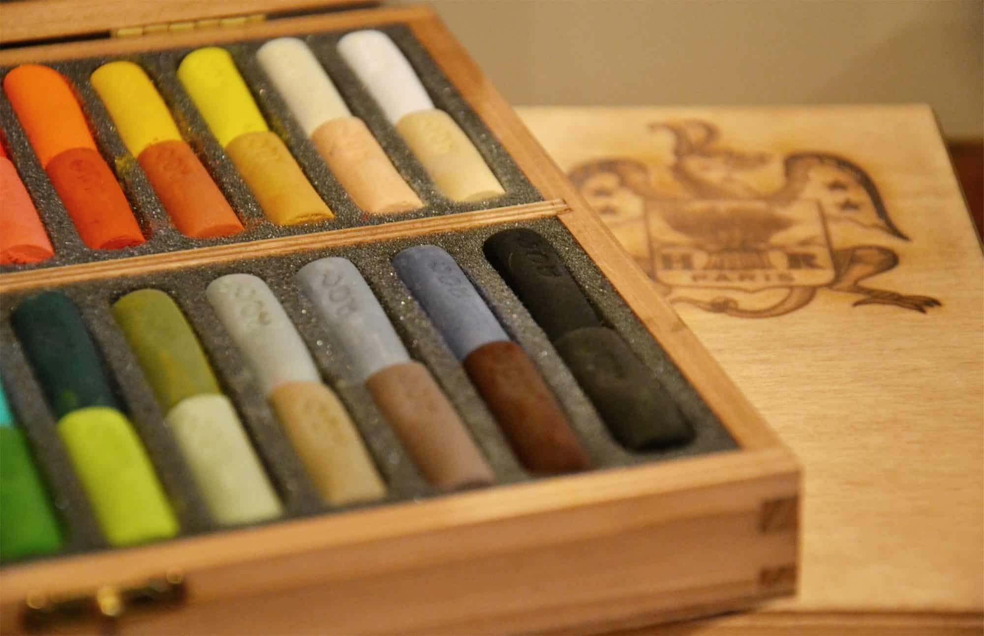 The Maison du Pastel art store in Paris sells the most beautiful colors of pastels all traditionally made, like this open wooden box of yellows, grays and oranges.