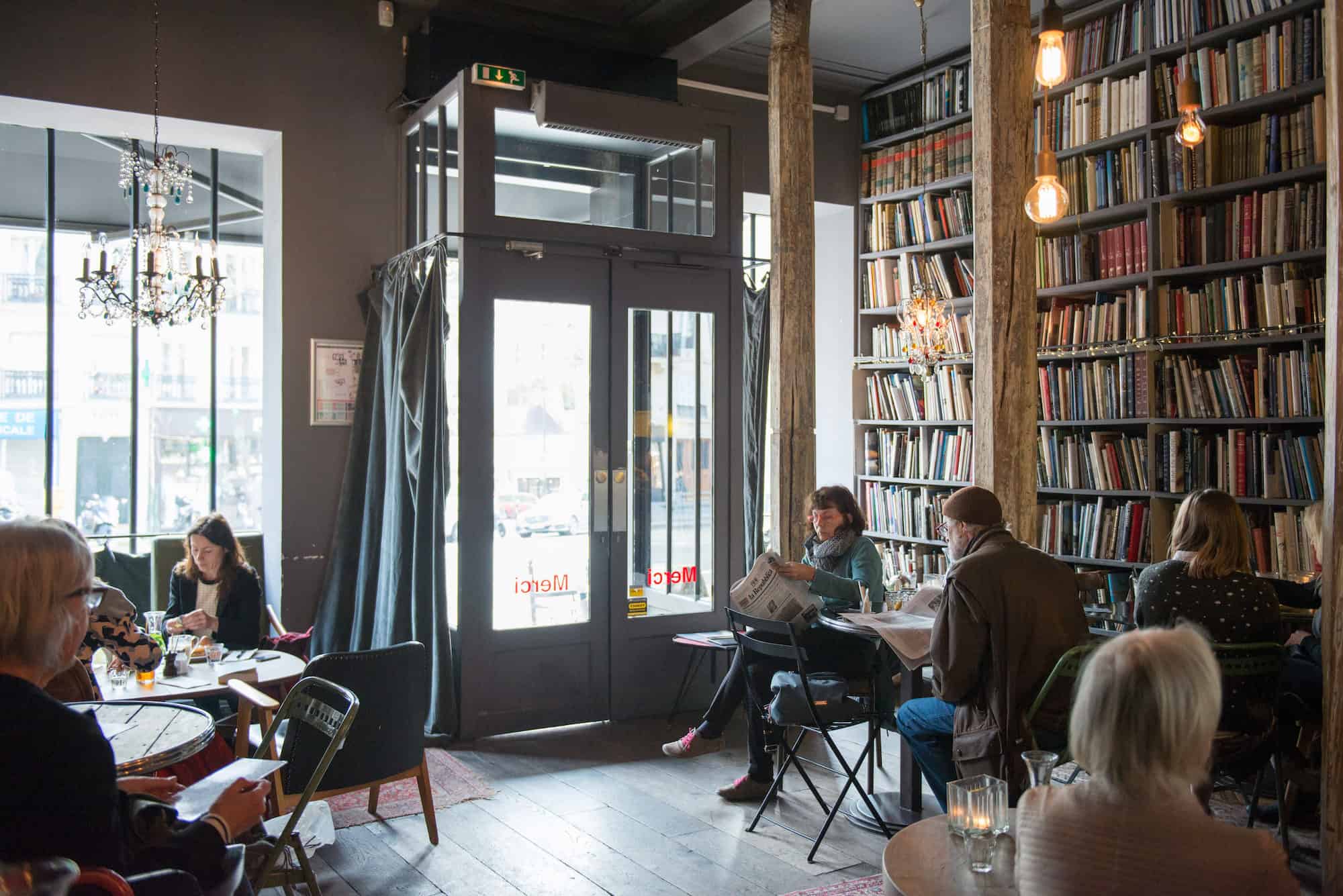 One of our favorite coffee shops in Paris is Merci in the Marais, for its cozy atmosphere and walls lined with bookshelves.