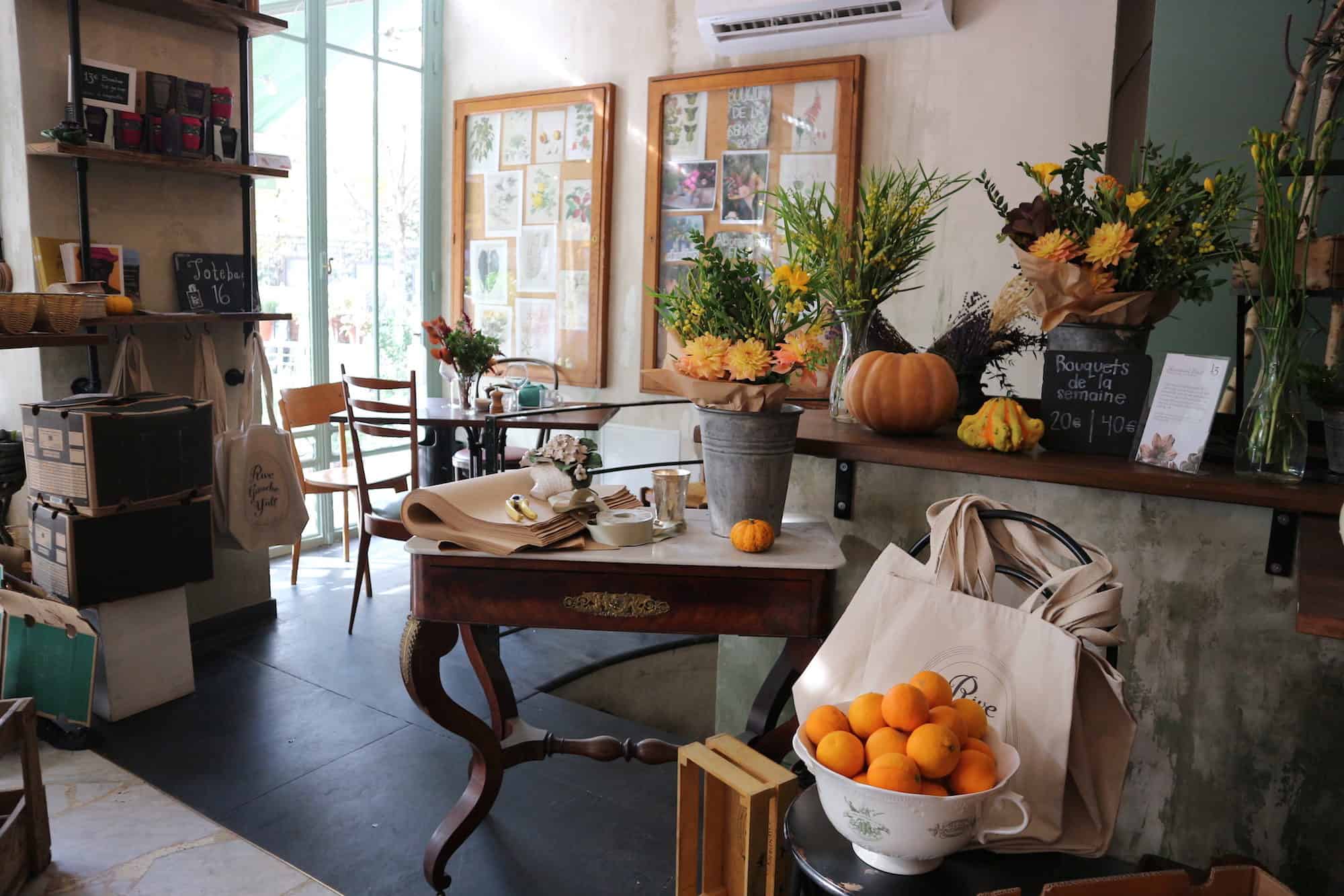 Inside Treize au Jardin coffee shop in Paris, where the rustic decor with plants and fruit reflect the home-made food served here.