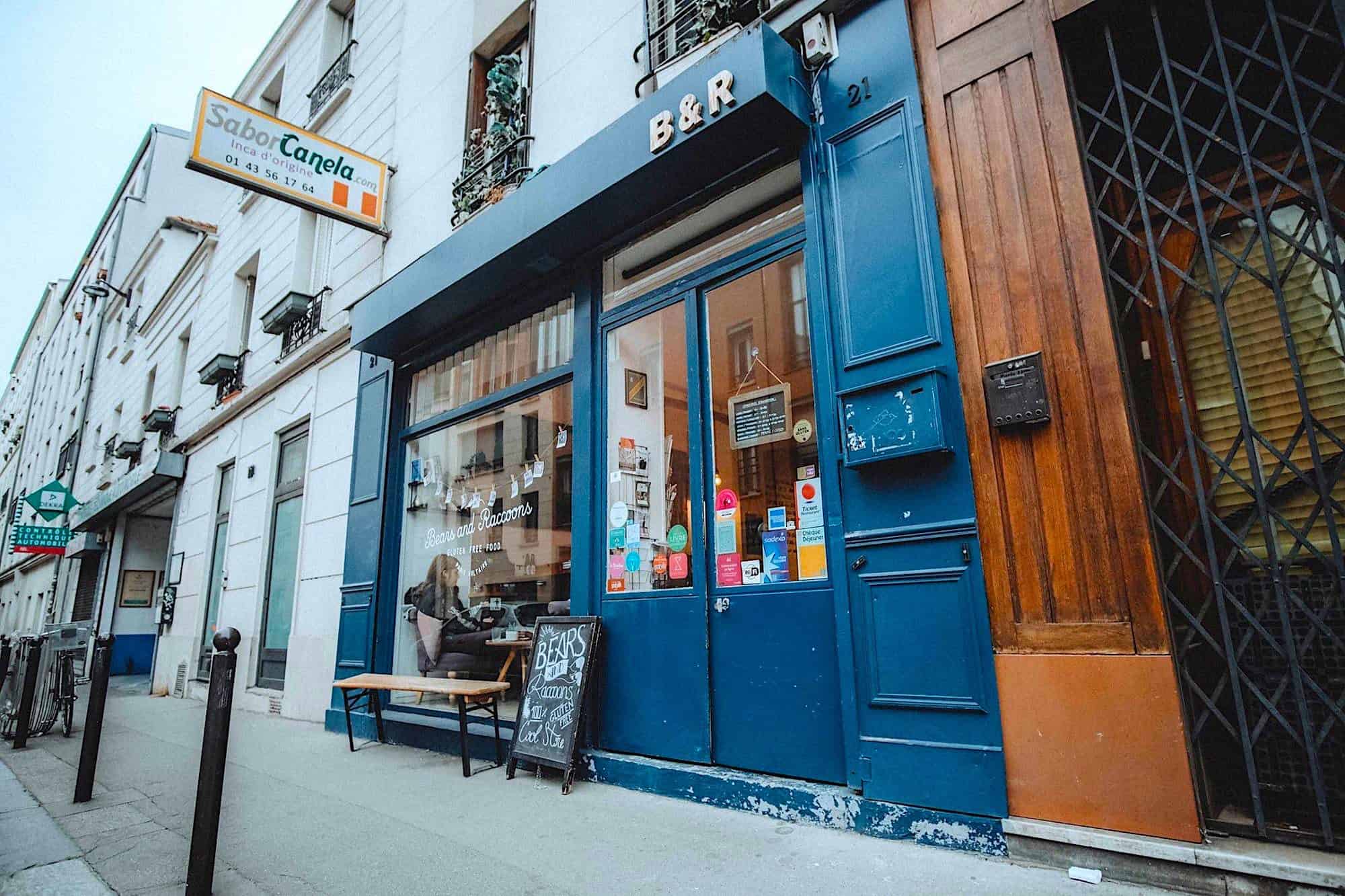 Outside Bears and Racoons gluten-free restaurant in Paris and its blue shop front.