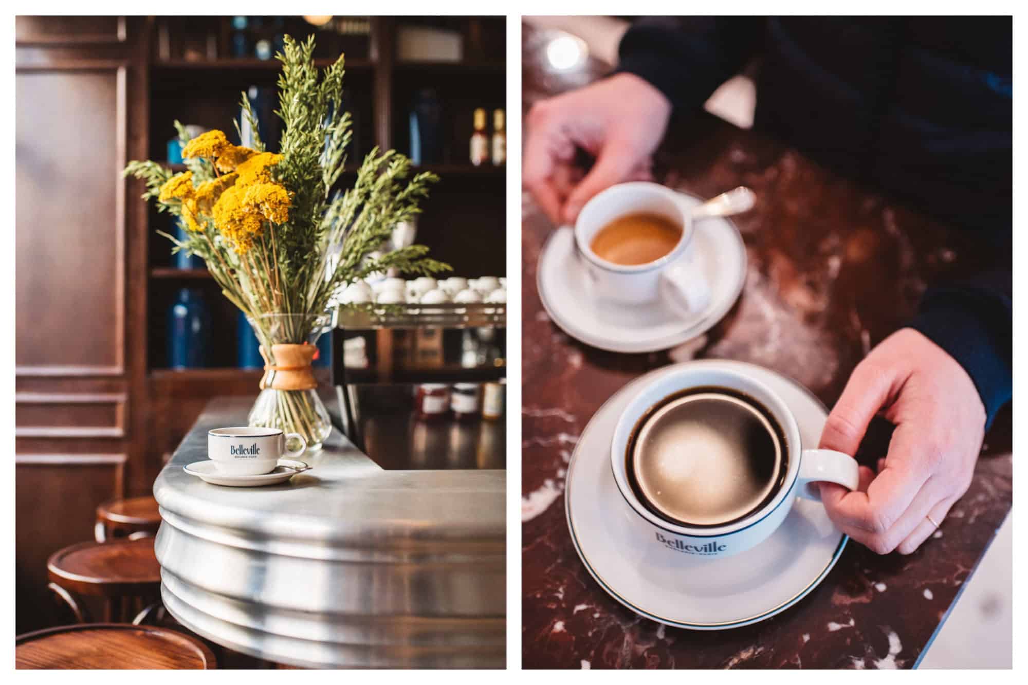 A cup of coffee on the counter of the Belleville Brûlerie coffee roasters in Paris set by a bunch of yellow dried mimosa in a vase (left). Two cups of coffee at the Belleville Brûlerie gluten-free coffee shop in Paris, set on a brown marble counter (right). 
