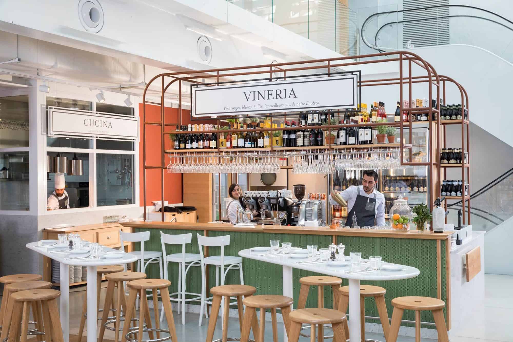 The bar and antipasti restaurant at Eataly in Paris comes with bright and light interiors.