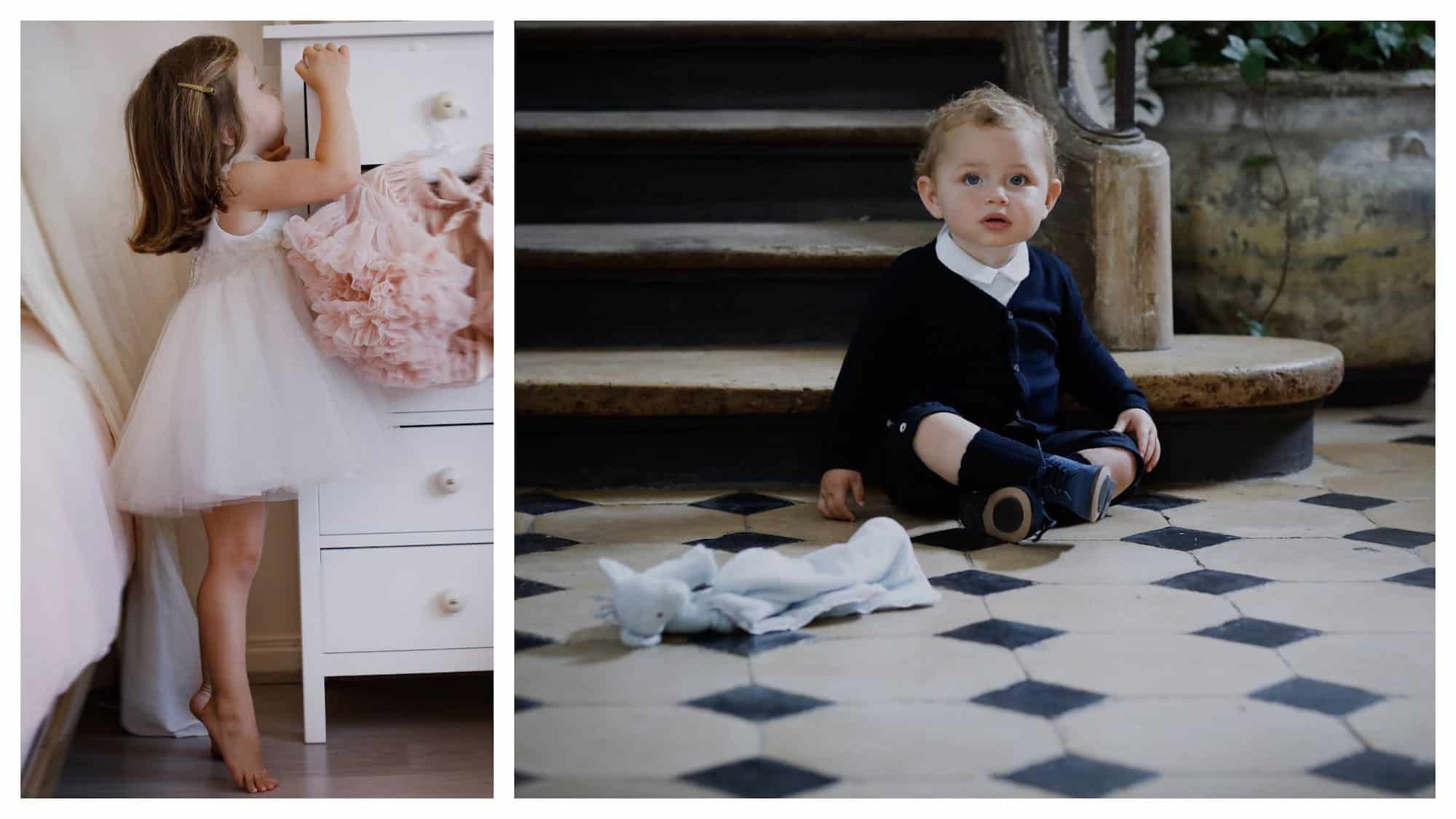 A little girl wearing a tutu and standing on tiptoe while peeping inside a drawer (left). A toddler wearing a chic navy cardigan and matching boots, sitting on tiled floors by a wooden Parisian staircase (right).
