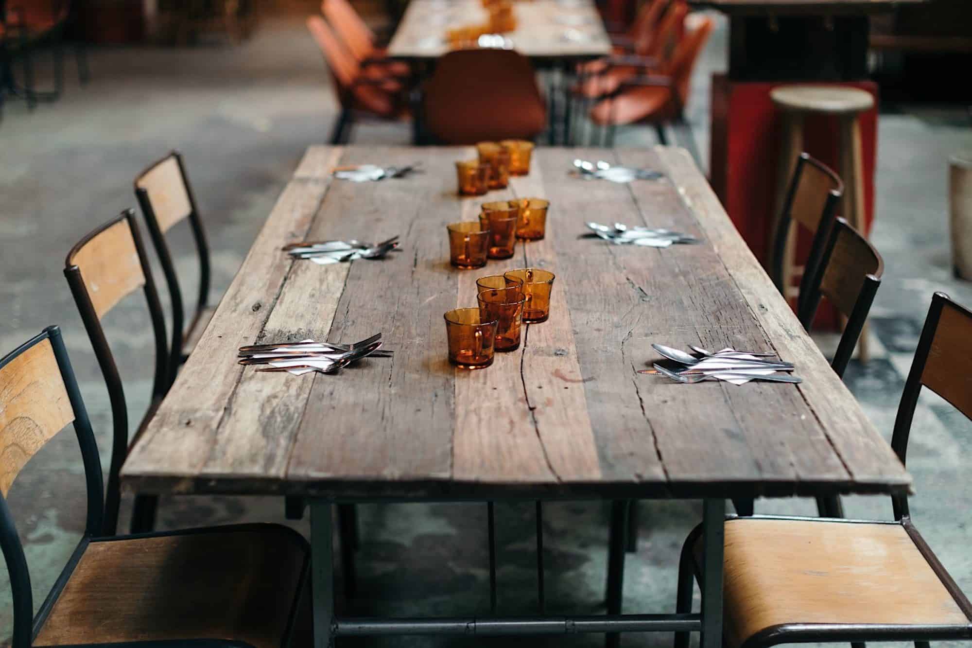 A timber table at the bohemian bar and eatery le Comptoir Général on the banks of the Canal Saint Martin. 