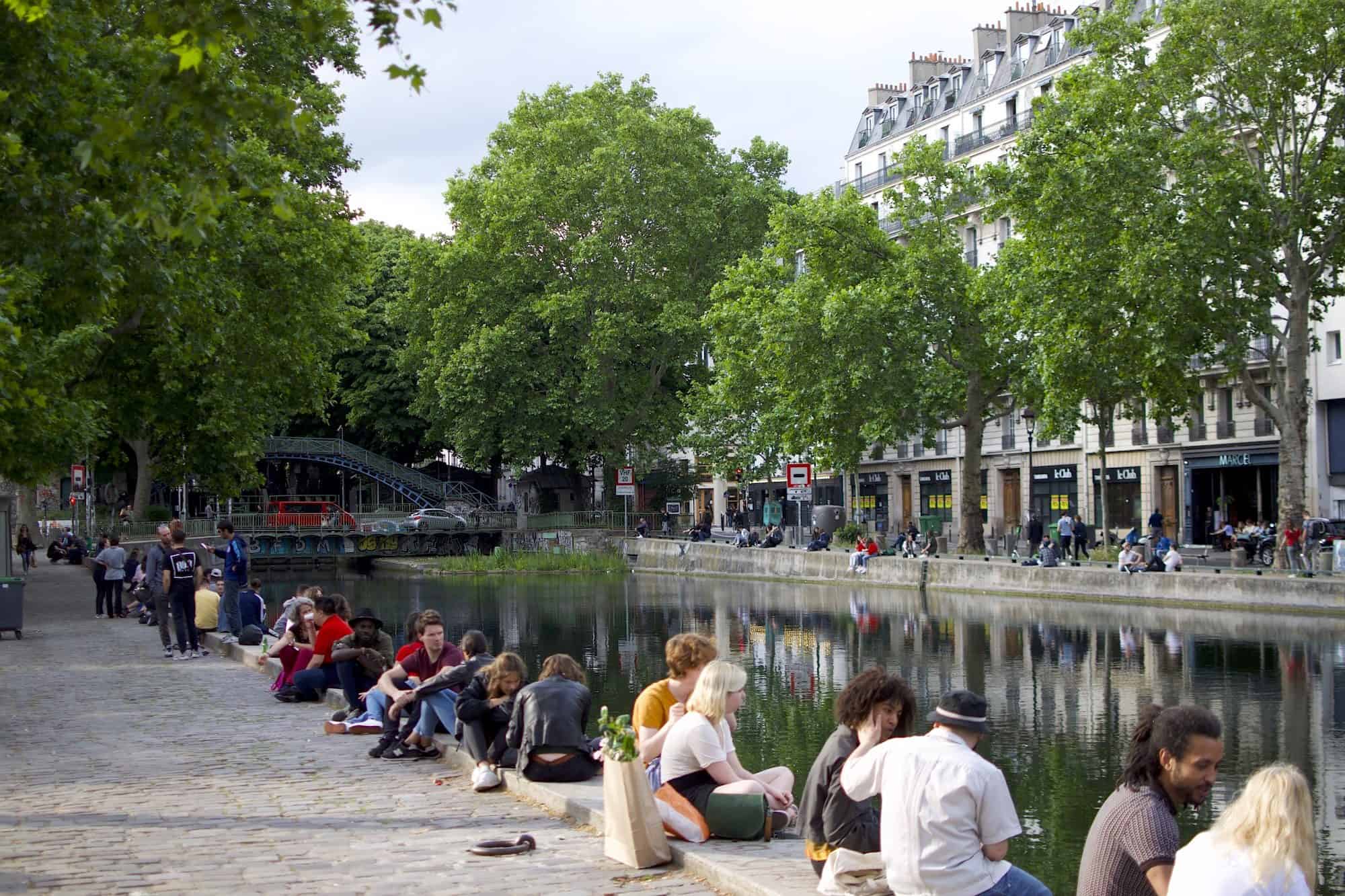 Locals love to come and relax by the water on the banks of the Canal Saint Martin in Paris.