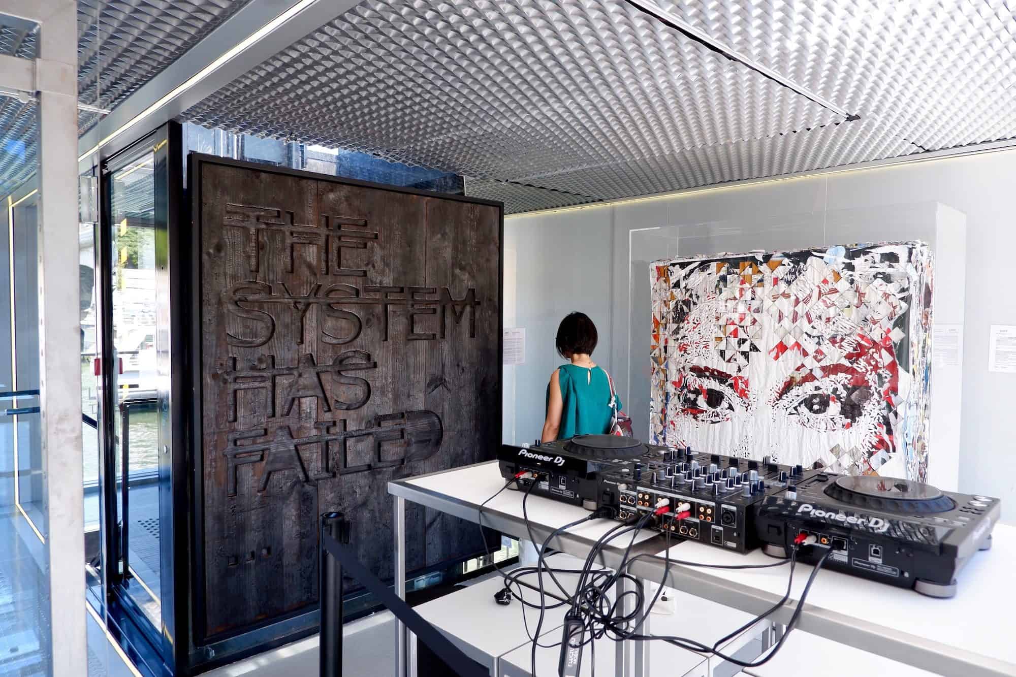 Street art works by Vhils and Rero at the new art center Fluctuart on the River Seine in Paris. 
