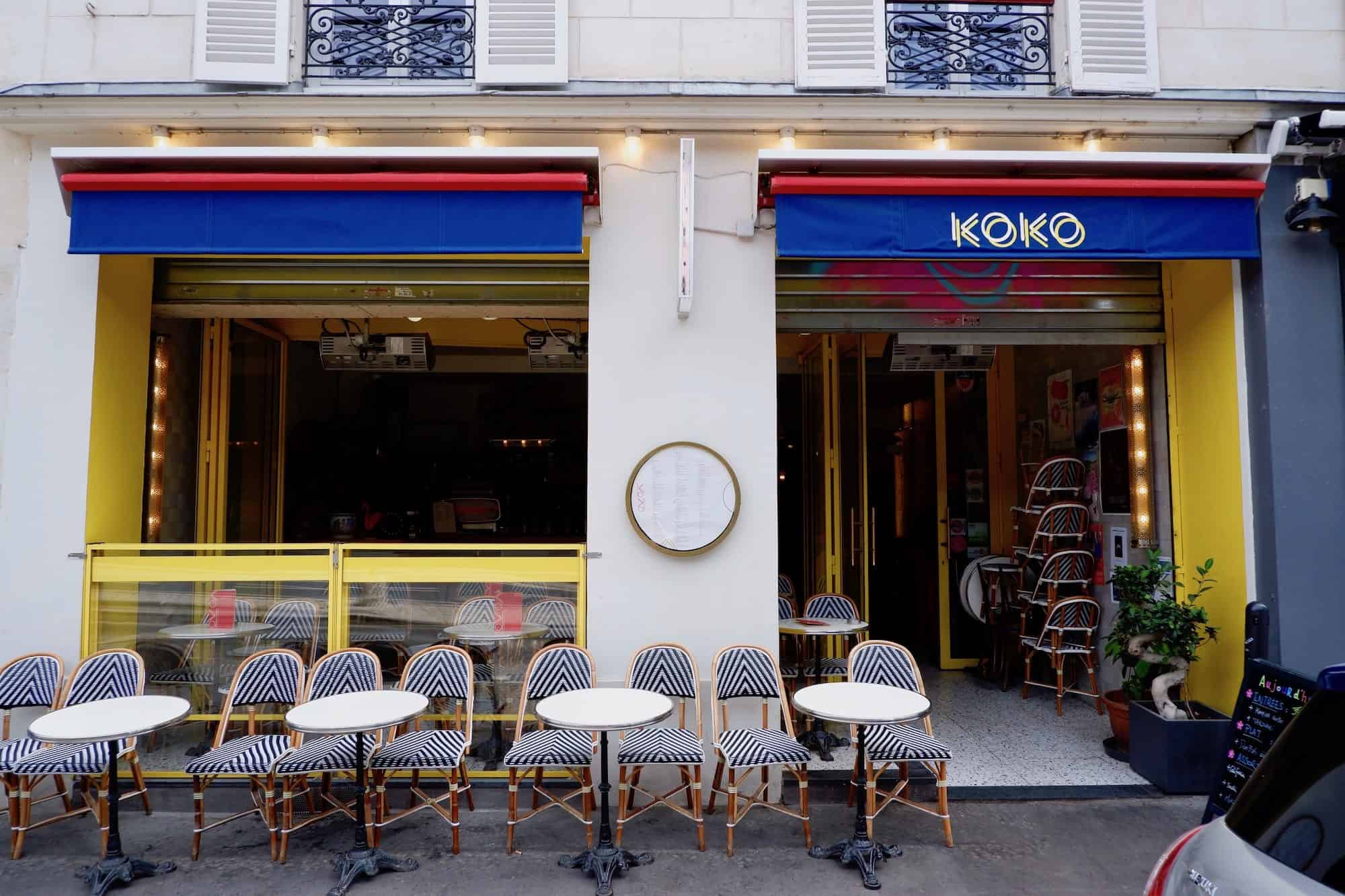 One of the quirky lively restaurants and bars on the canal de l'Ourcq, Koko Canal, with its bright yellow, red and blue exterior.