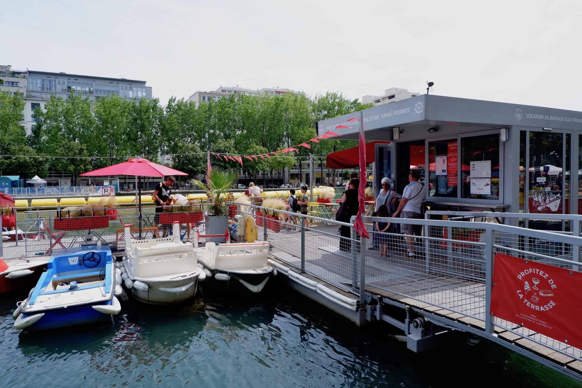 You can rent a small boat to sail along the canal in Paris from this floating pier.
