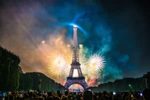 fireworks behind the Eiffel Tower.