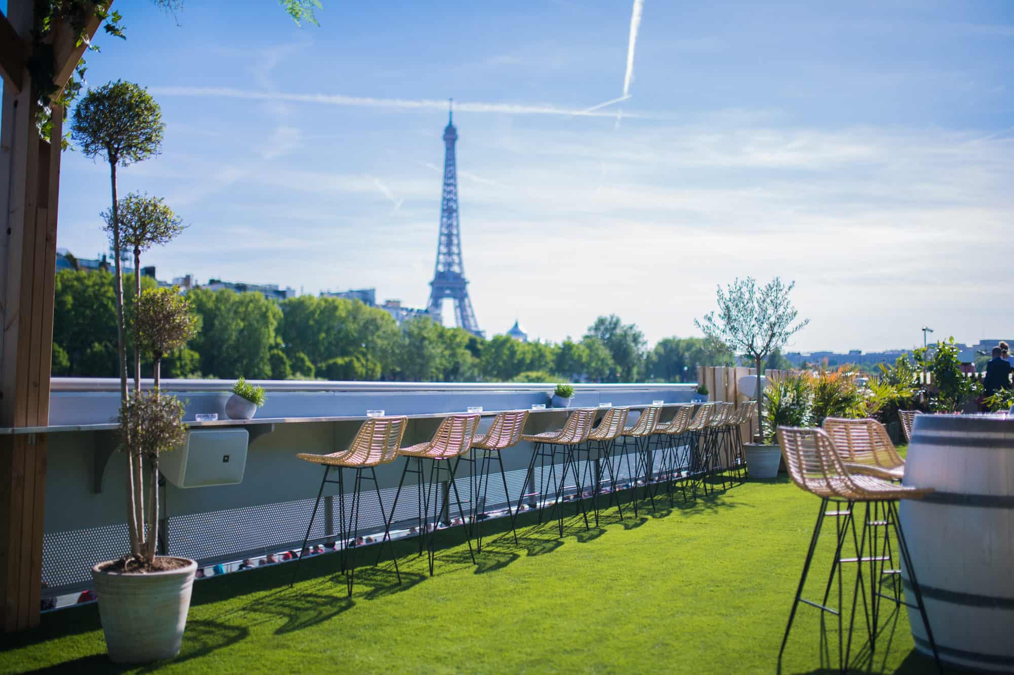 The view of the Eiffel Tower from the top of the barge boat bar Mademoiselle Mouche.