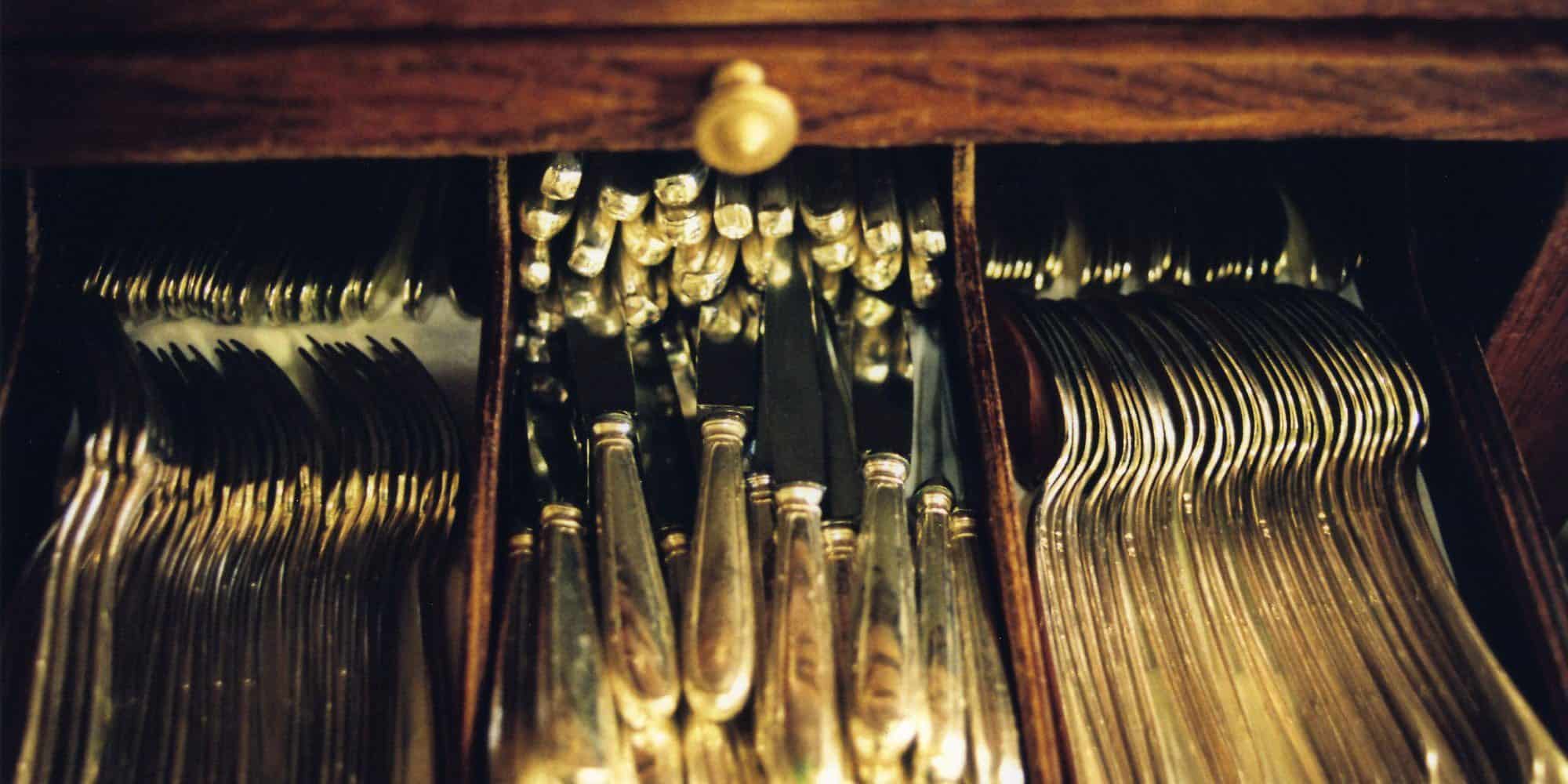 Culterly drawer filled with silverware at Benoit bistro in Paris.