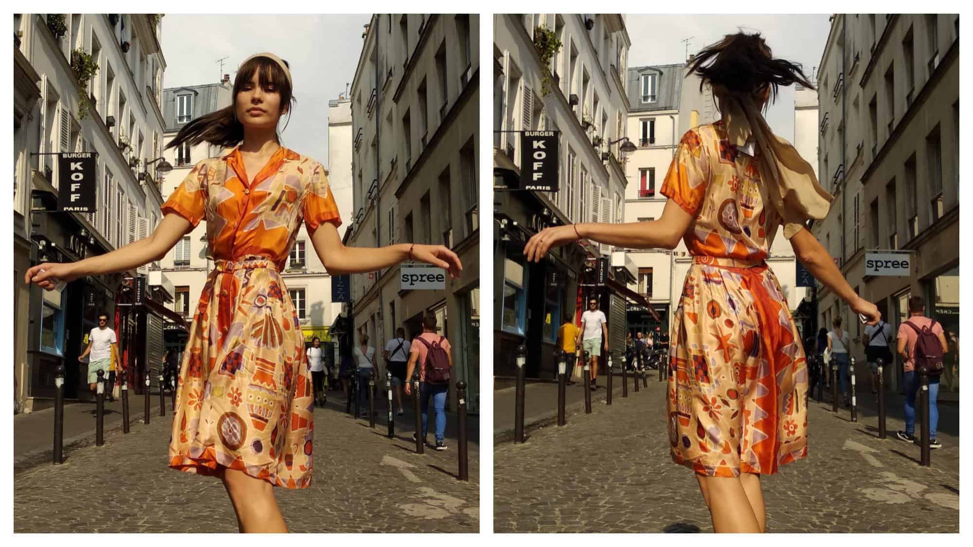 A model wearing an orange silk print dress from Spree in Montmartre.