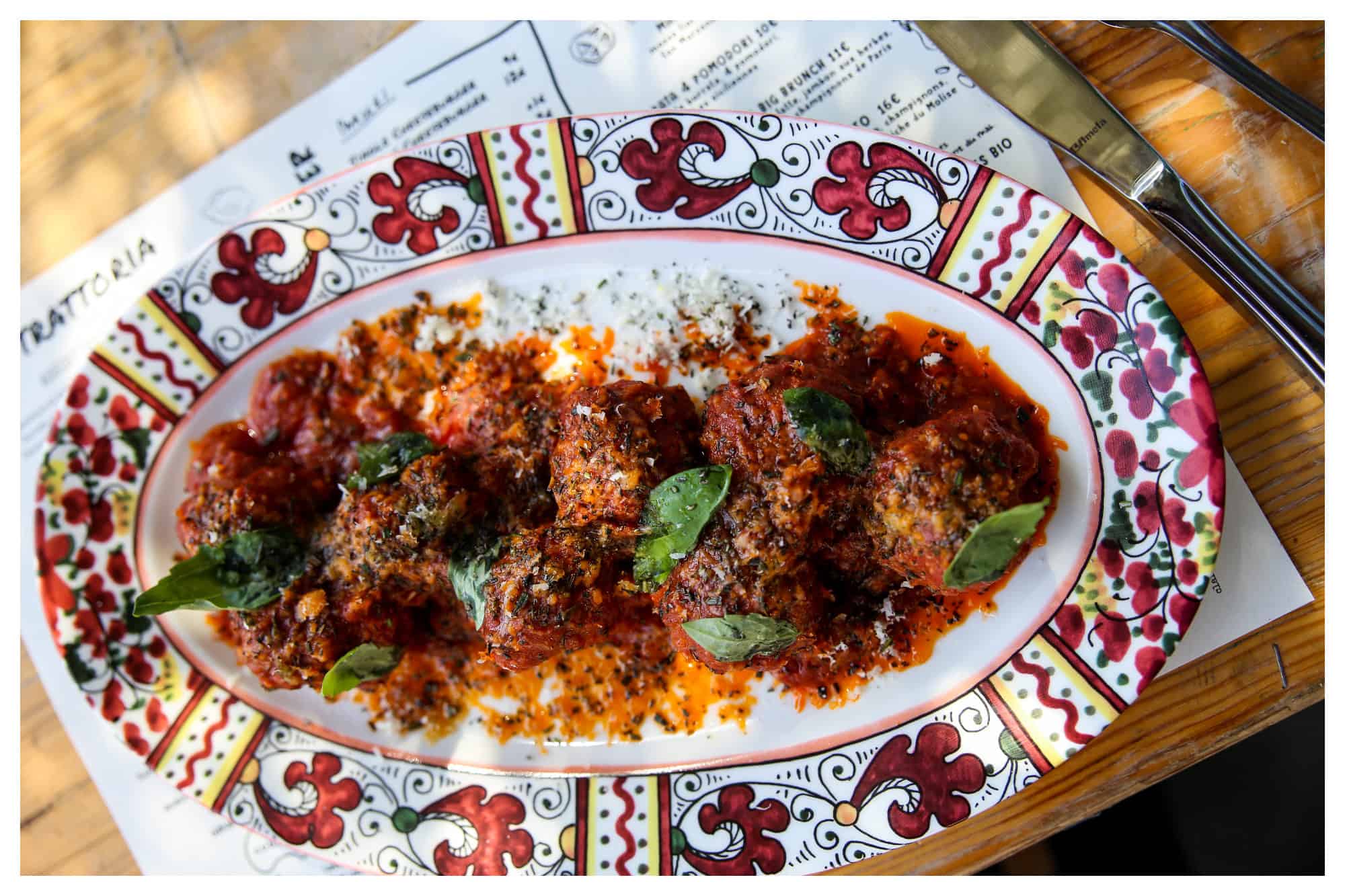 Meat ball dish from La Felicita restaurant in Paris, served in a colorful hand-painted ceramic dish.