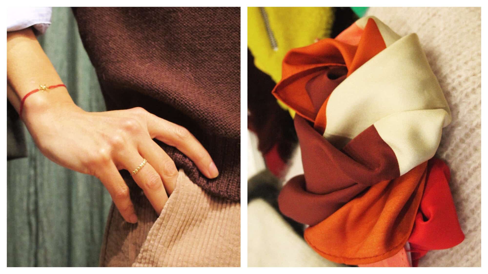 Left: a close up of a woman's hand on her hip. She's wearing a delicate gold ring on one finger and a string bracelet with a gold pendant. She's wearing a pale blue shirt with the sleeve rolled up, a brown knit jumper and camel corduroy pants. Right: a close up of a brown, orange, red and cream scarf knotted and sitting on a cream knit. 