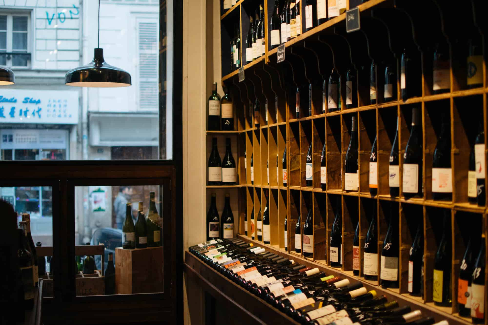 A wide selection of natural wines is shelved at La Cave de Bellville, a natural wine bar in Paris.