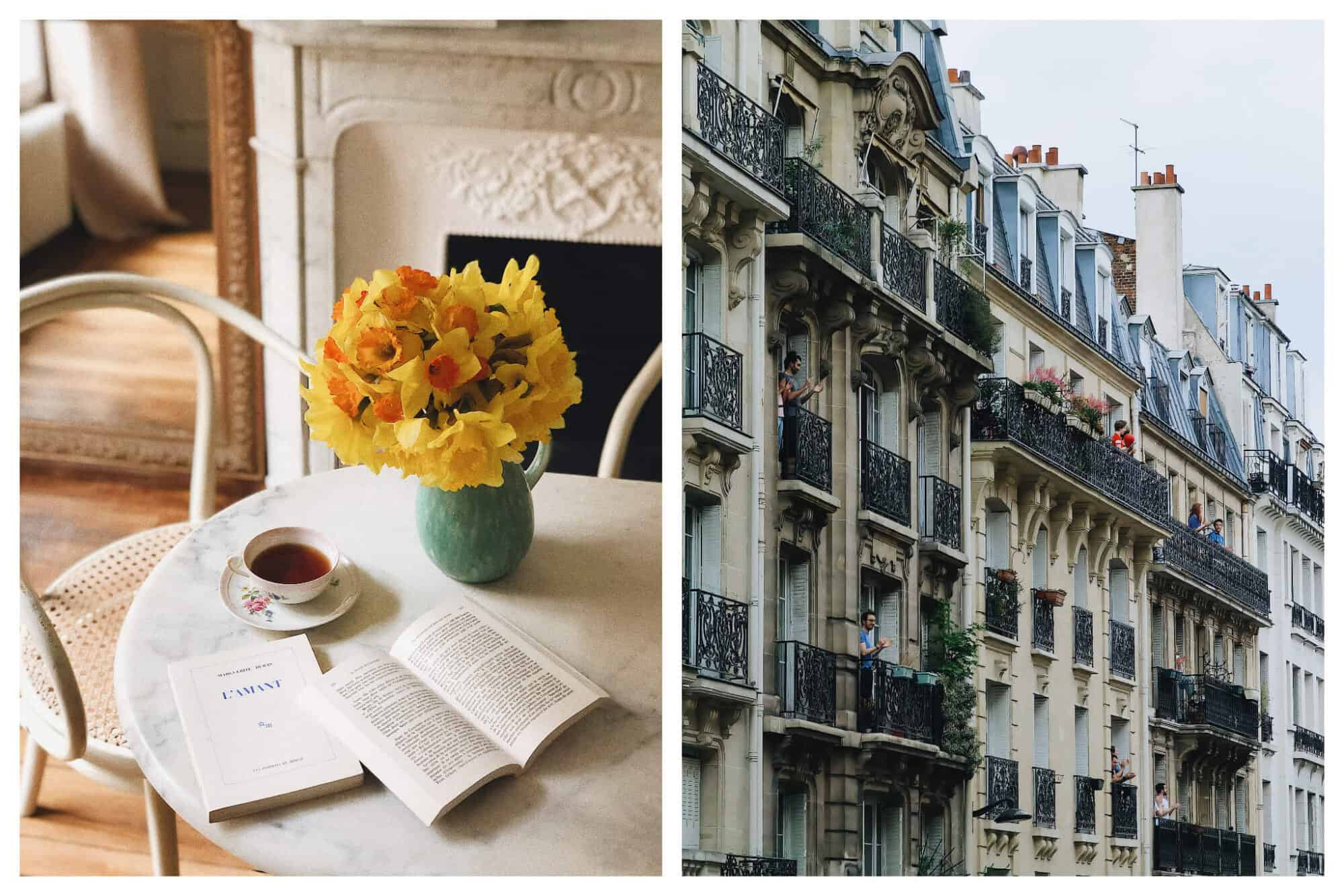 Left: Books, tea, and beautiful yellow flowers inside a blue vase sit atop a white marble table, Right: A view of Parisian apartments on a gray day.