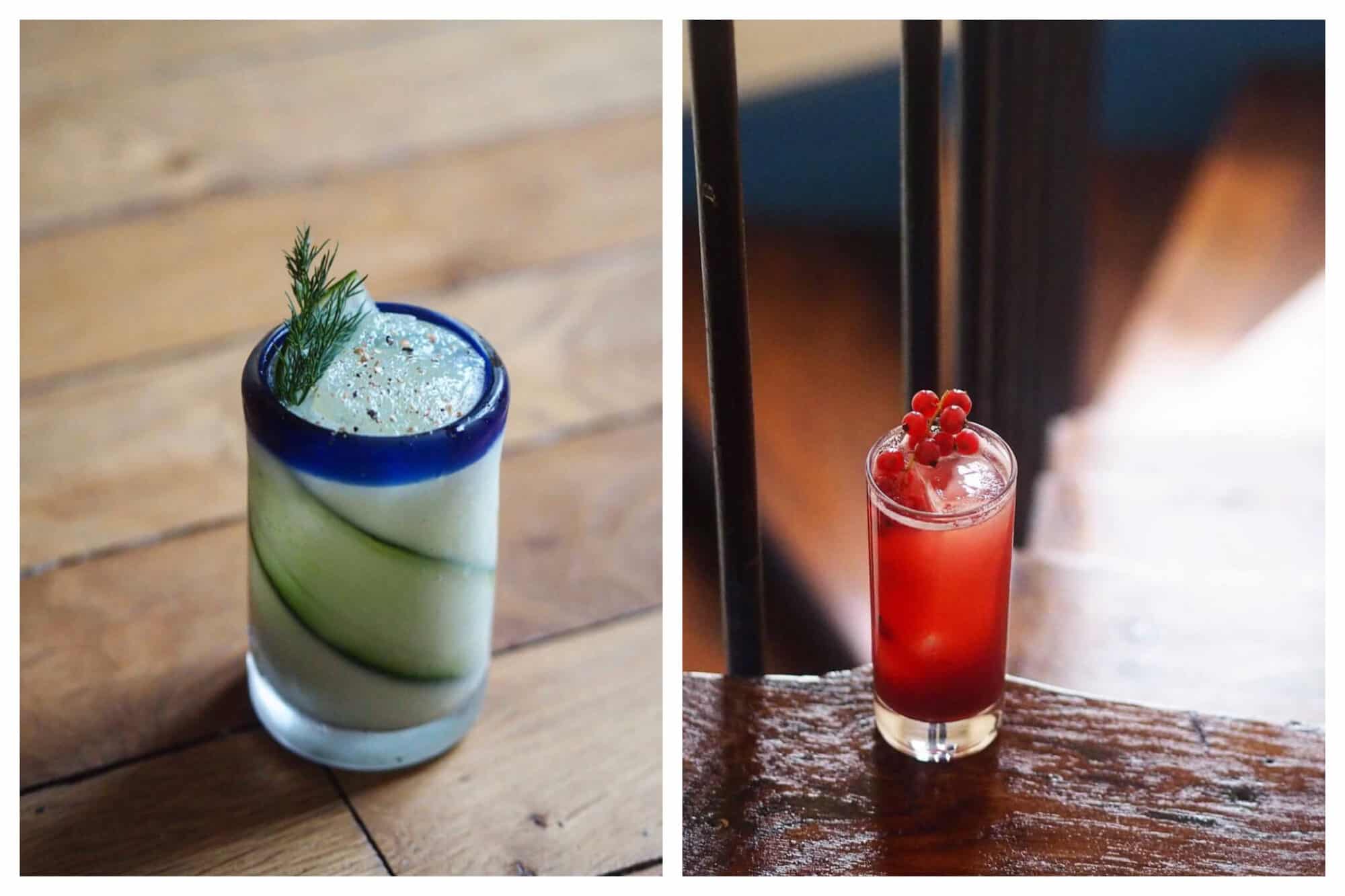 Left: a cocktail with a strip of cucumber inside on a wooden background. 
Right: a red cocktail with berries on top sitting on a step of a wooden staircase. 