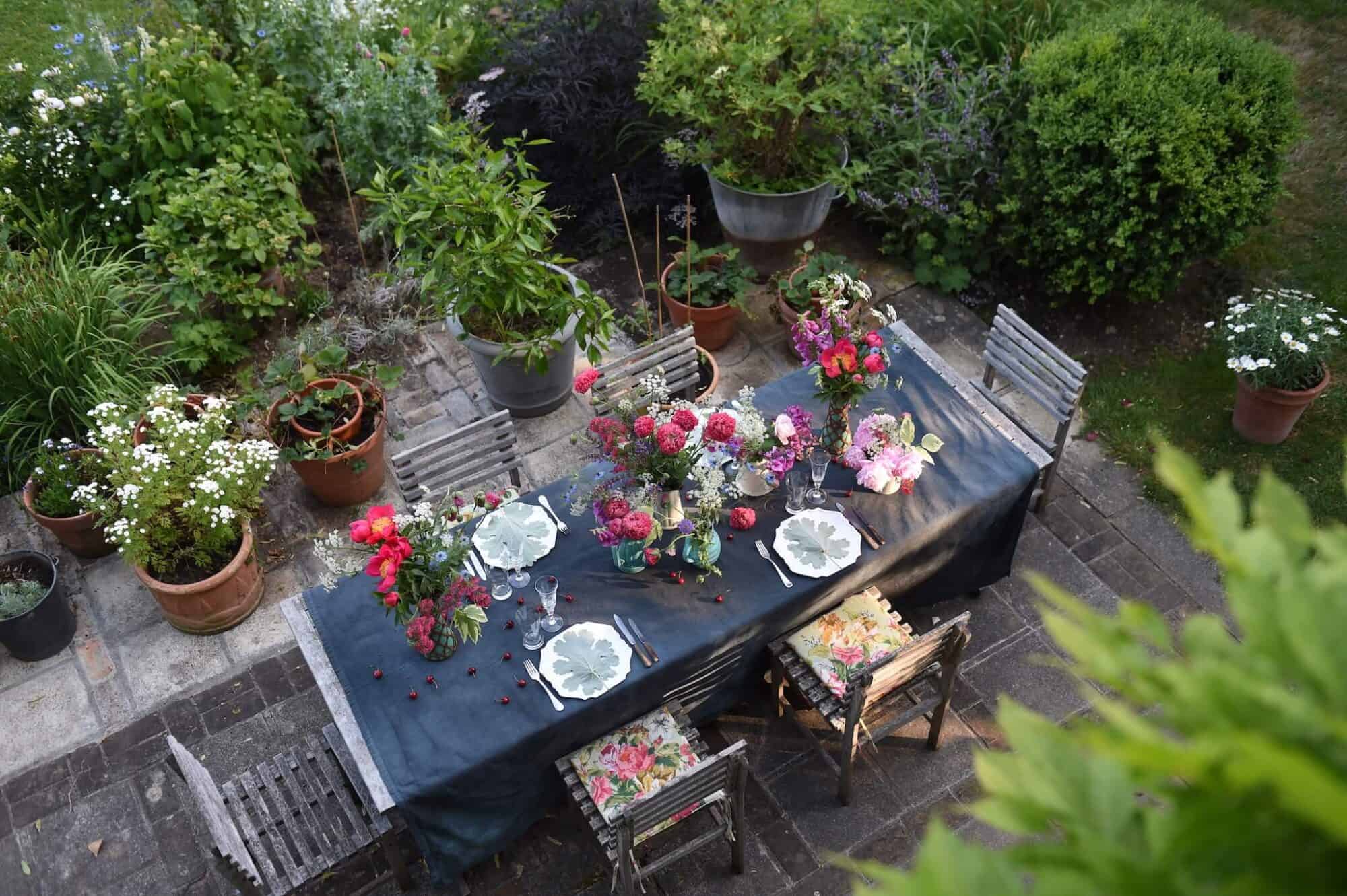 A table set for lunch in a Normandy garden.