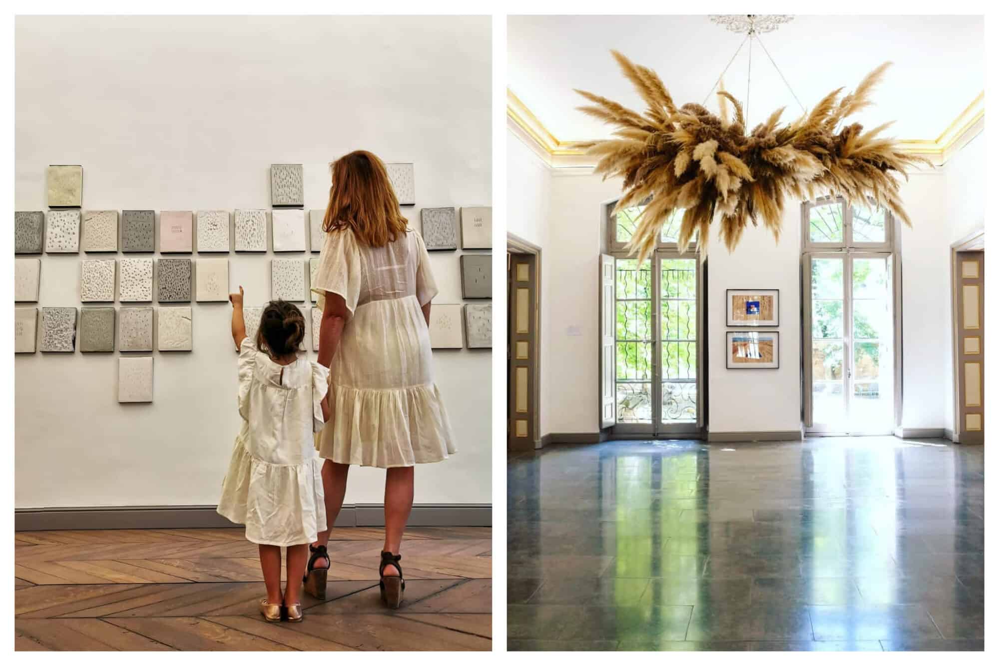 Left: A mother and daughter discuss art on display in the culture center at the Hôtel du Caumont, Right: A large, feathery art piece hangs from the ceiling at the Hôtel du Caumont 