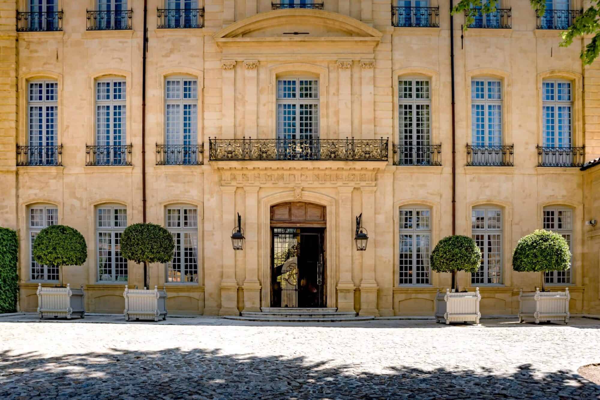 The front of Hôtel de Caumont on a sunny day in Aix-en-Provence