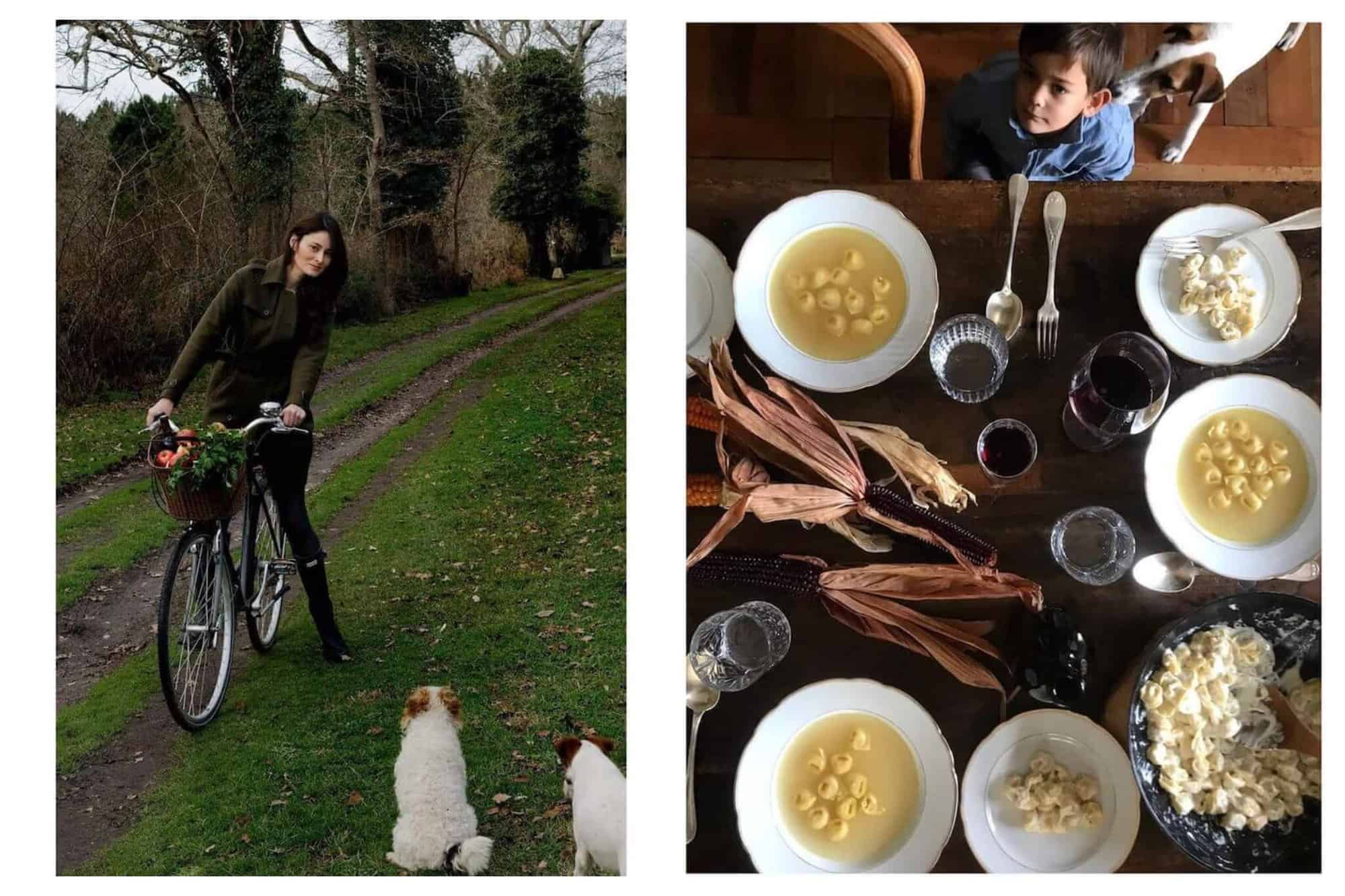 Left: a woman is on a bike on a outdoor path. There is grass with a few different dirt track marks which make out the path. There is a basket on the bike filled with vegetables. The woman has brown hair and is wearing dark clothing. She is looking at two white and brown dogs which are in the bottom left corner. Right: an aerial view of a table with food on it. There are three bowls of soup with small raviolis in it. There are a few glasses of wine and water and there are ears of dark colored corn on the table. A little boy wearing a blue shirt is looking up and there is a small brown and white dog behind him. 