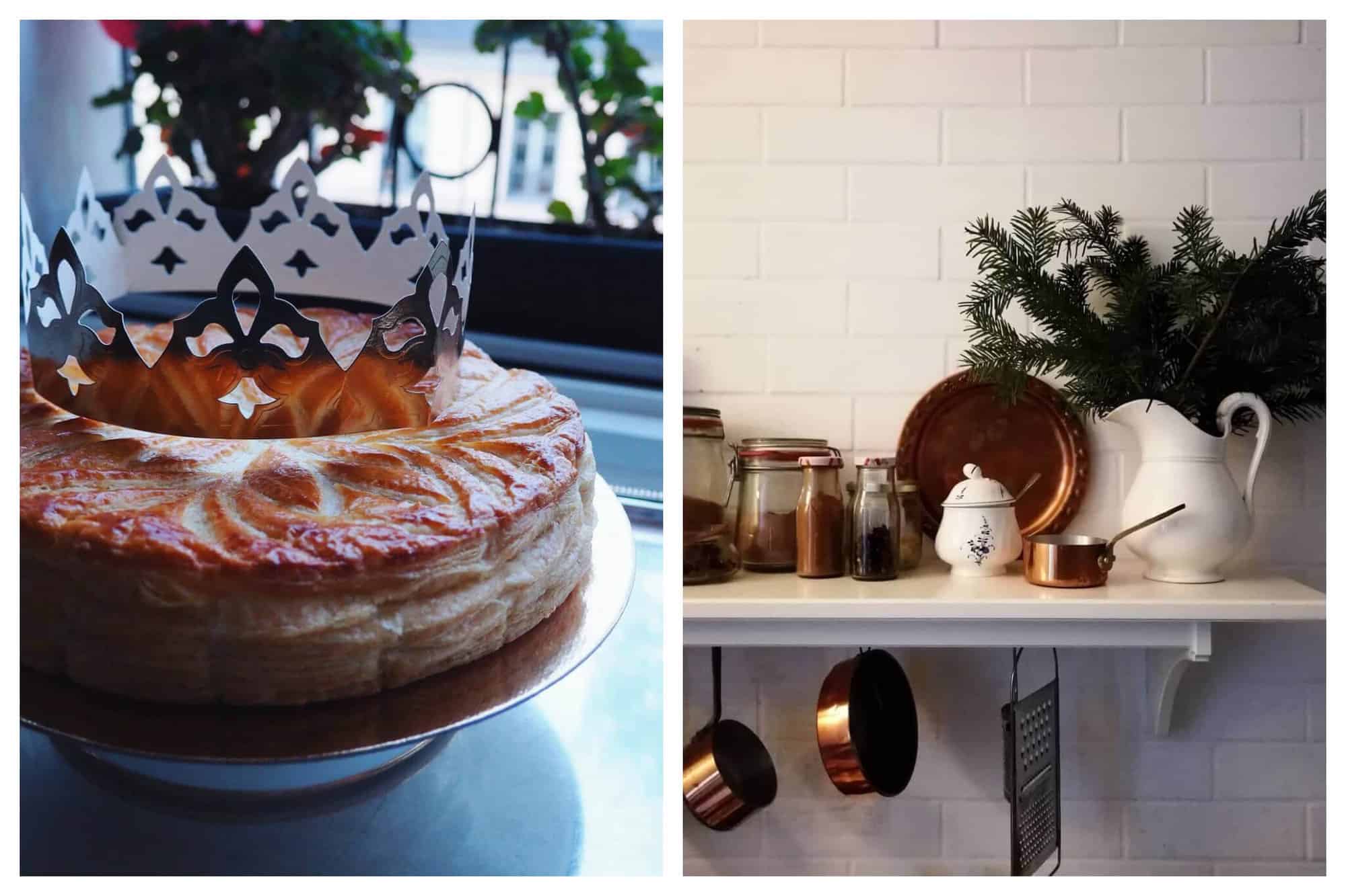 Left: a Galette de Rois cake on a gold platter with a gold crown on top of it. Some greenery on a window can be seen in the background. Right: a shelf in a French kitchen. The wall is covered with white subway tiles. There are jars with spices, copper pans, and a large white water jug filled with pine branches on the shelf. There are copper pans and a silver cheese grater hanging from the shelf. 