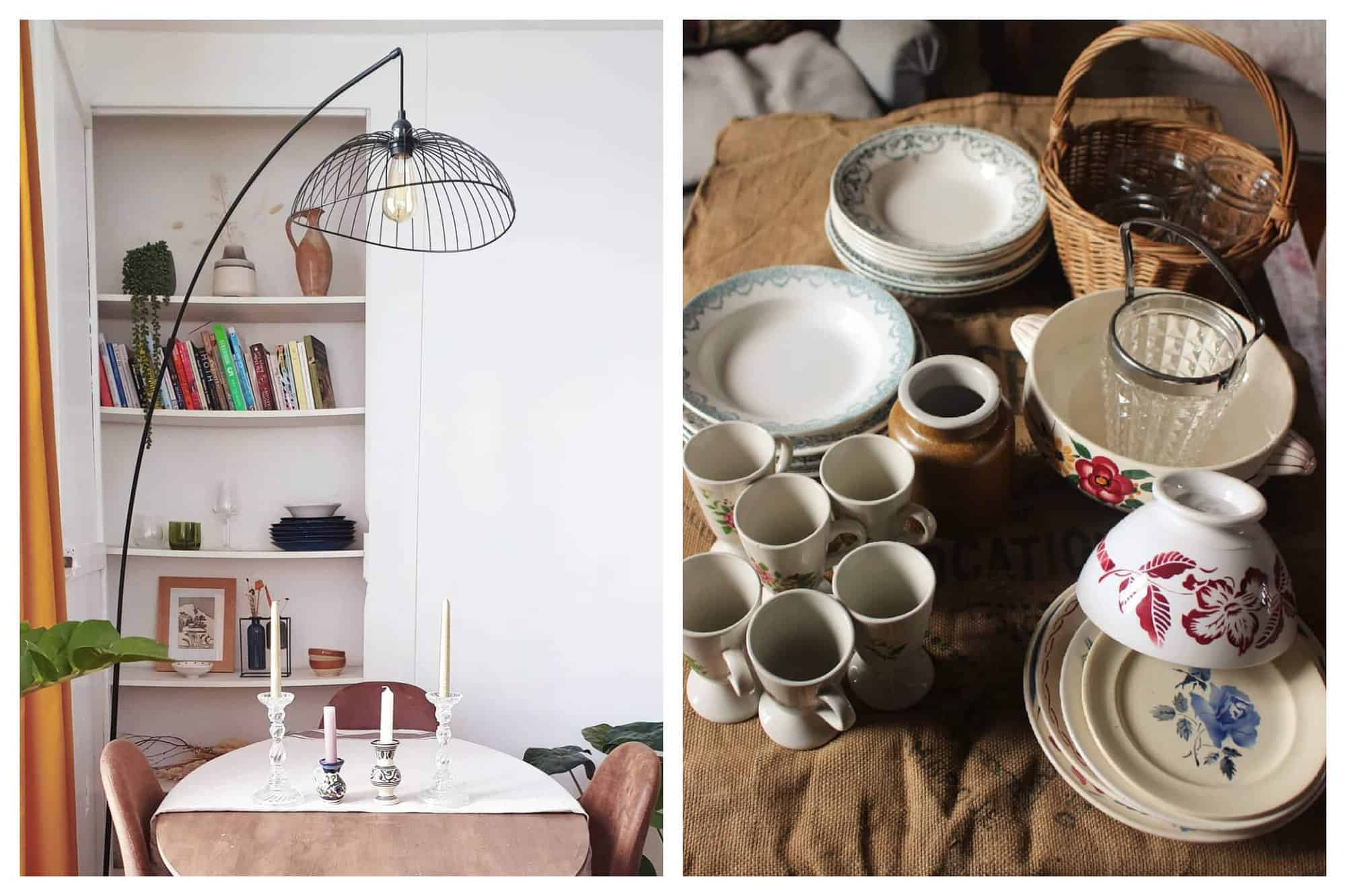 Left: The interior of a Parisian apartment is pictured. A dining table with candles and a bookshelf are pictured, as well as a tall, thin standing light fixture. Right: A collection of unique vintage dishware is pictured, including mugs, plates, and a bowl.