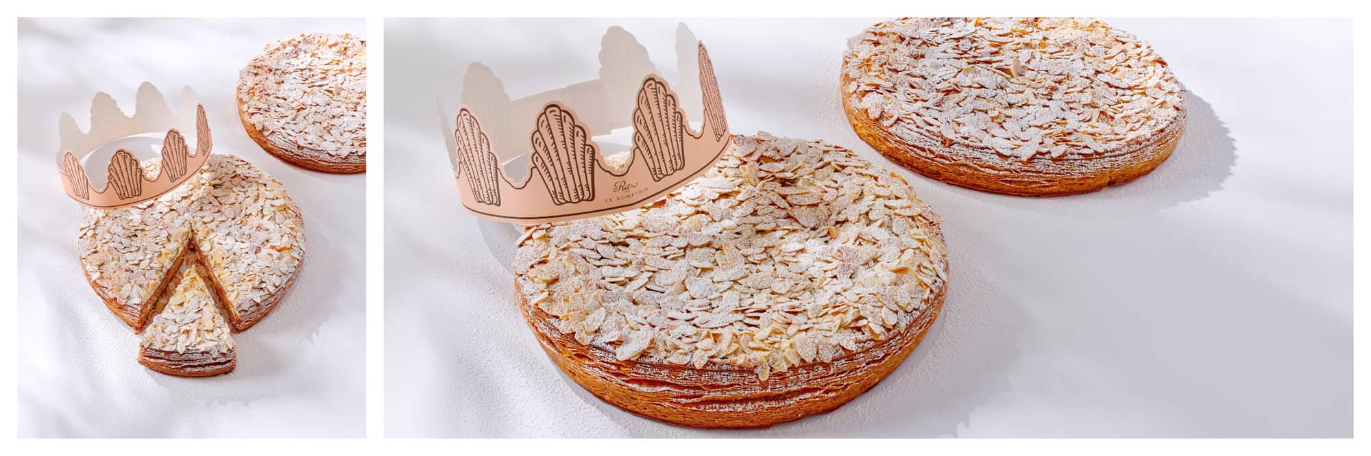 Galettes des rois topped with sliced almonds and icing sugar with a paper crown sitting on top by The Ritz Paris Le Comptoir. 